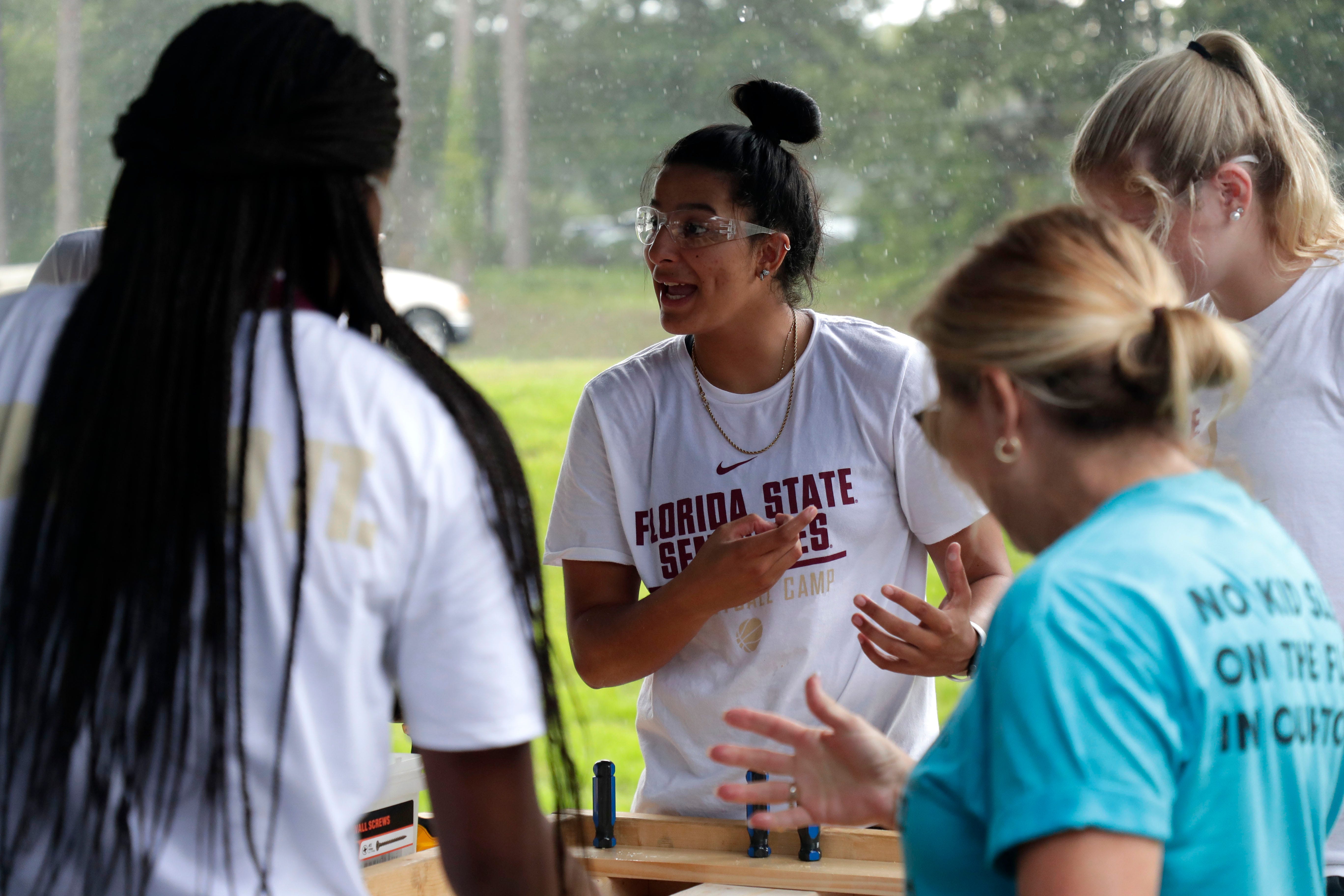 Izabela Nicoletti, a member of the Florida State women's basketball team, works with her teammates to build beds for children in the Big Bend. FSU women's basketball teamed up with Texas Roadhouse and other volunteers to complete the project Tuesday, July 23, 2019. 