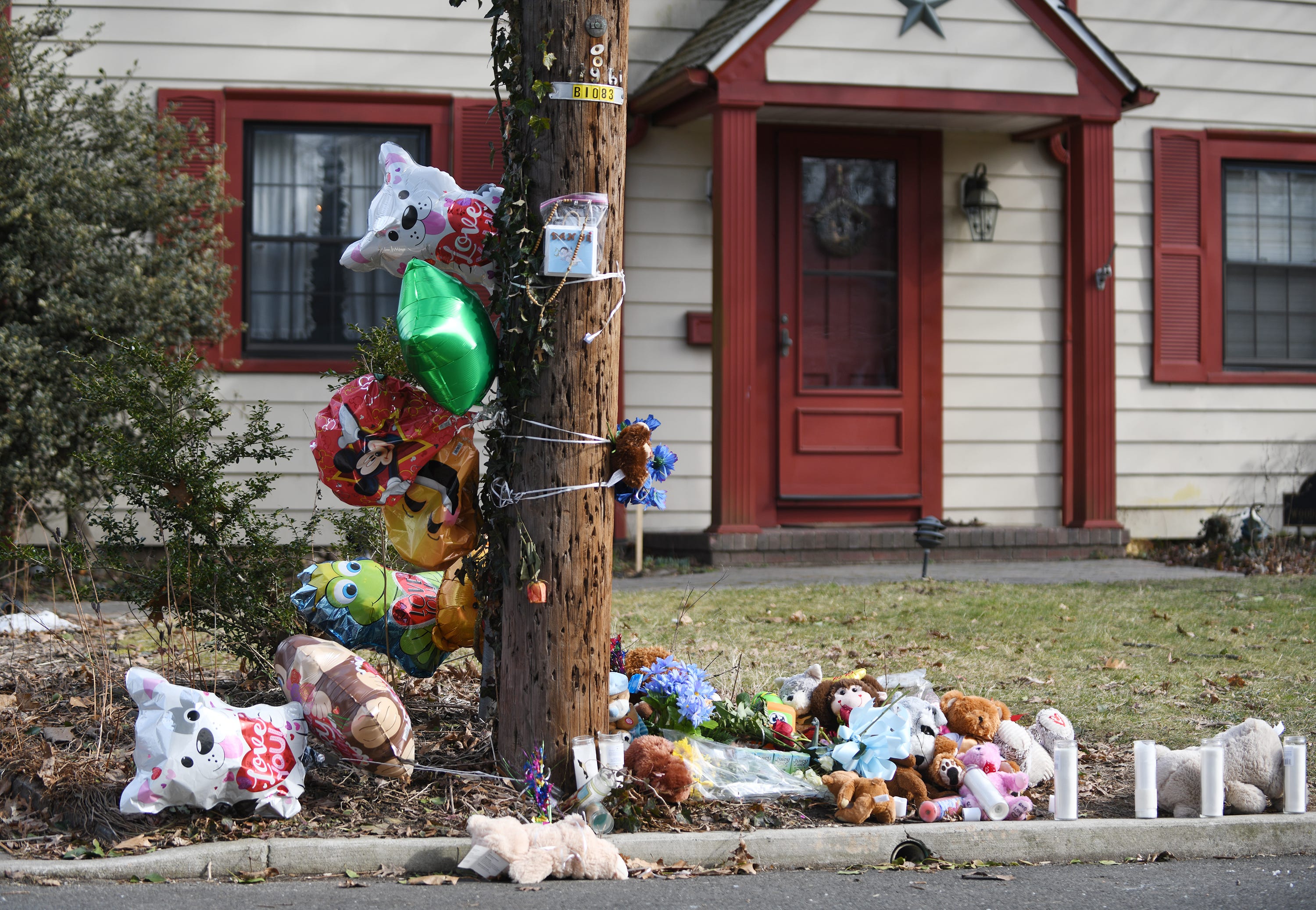 A roadside memorial was on display outside the Bridgeton home of 2-year-old Daniel Griner Jr. on Thursday, Feb. 14, 2019. Authorities say his burned and dismembered remains were found in a purse and trash bags underneath a shed at the family's home on Woodland Drive.