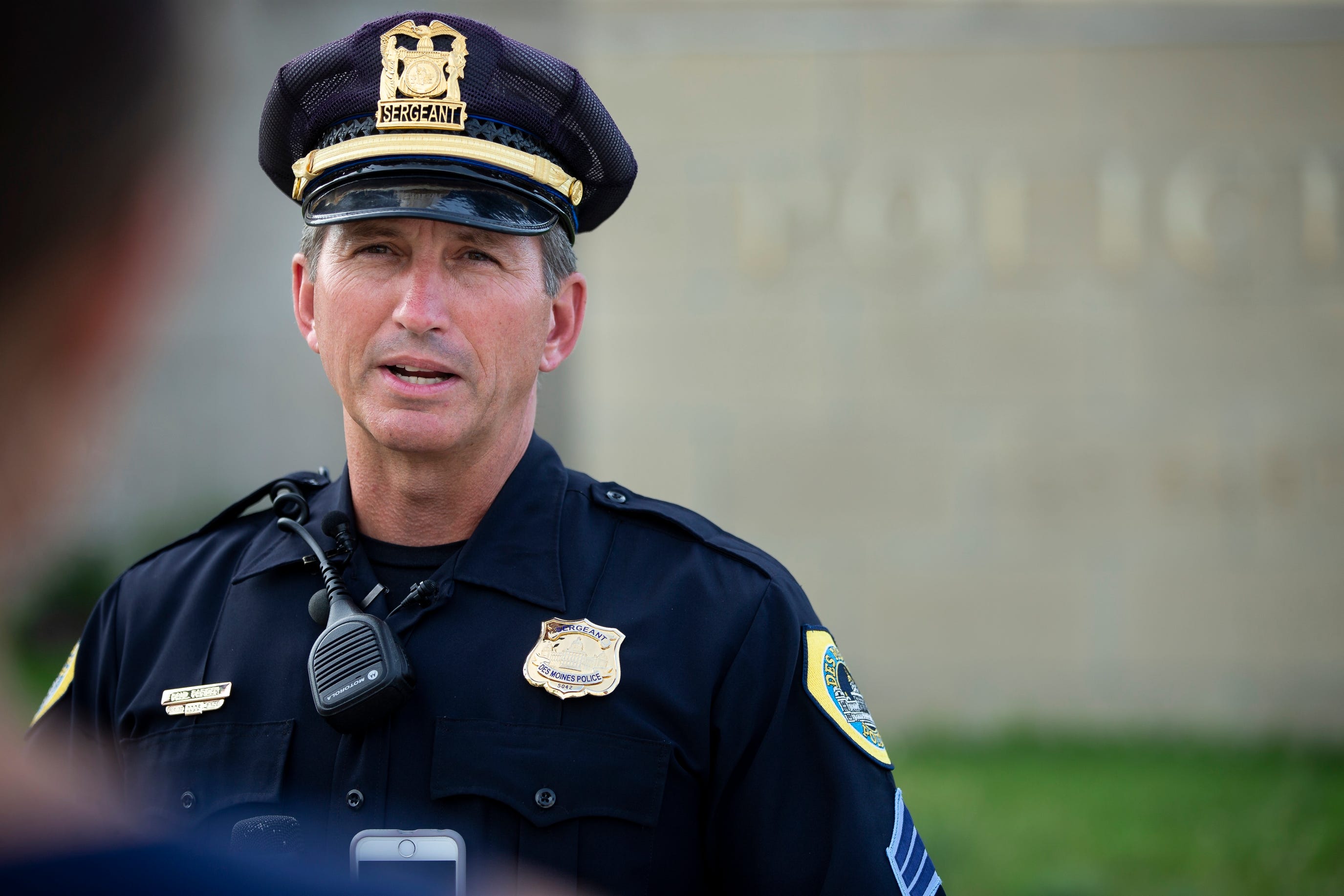 Des Moines Police Sgt. Paul Parizek addresses members of the press after Police were called to a home where three people were found dead on Wednesday, July 17, 2019, in Des Moines.