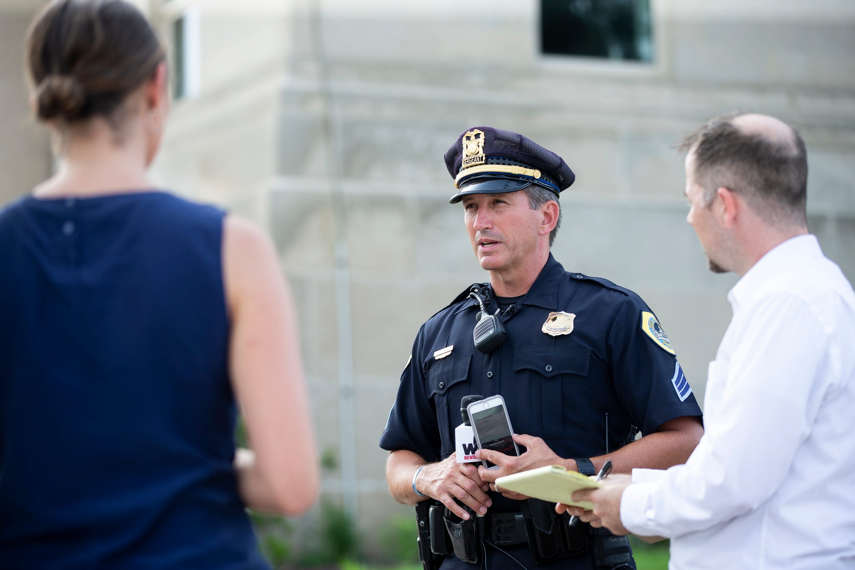Des Moines Police Sgt. Paul Parizek addresses members of the press after Police were called to a home where three people were found dead on Wednesday, July 17, 2019, in Des Moines.