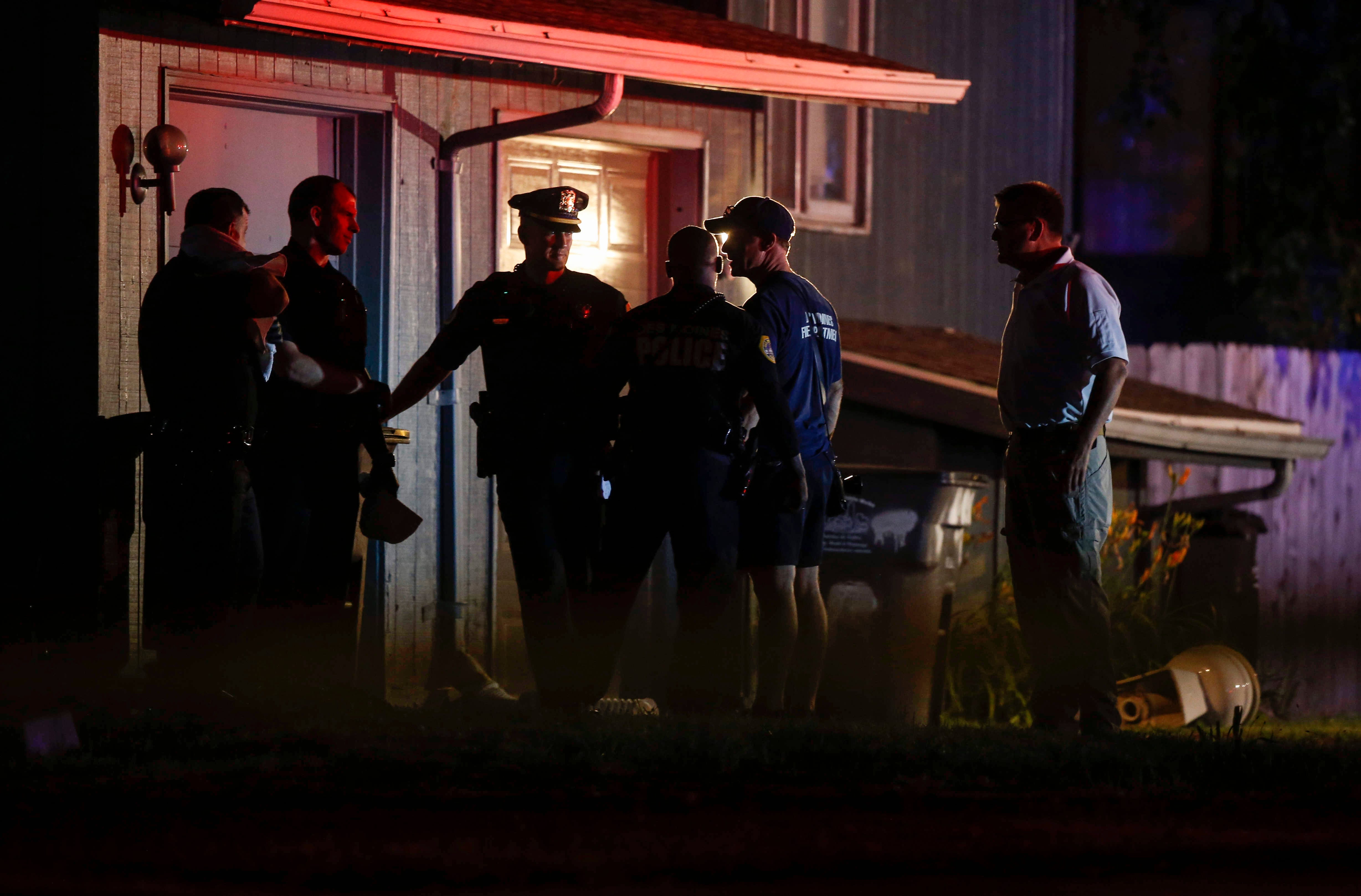 Des Moines police work the scene at a home on Day Street where multiple people were found deceased late on Tuesday, July16, 2019.