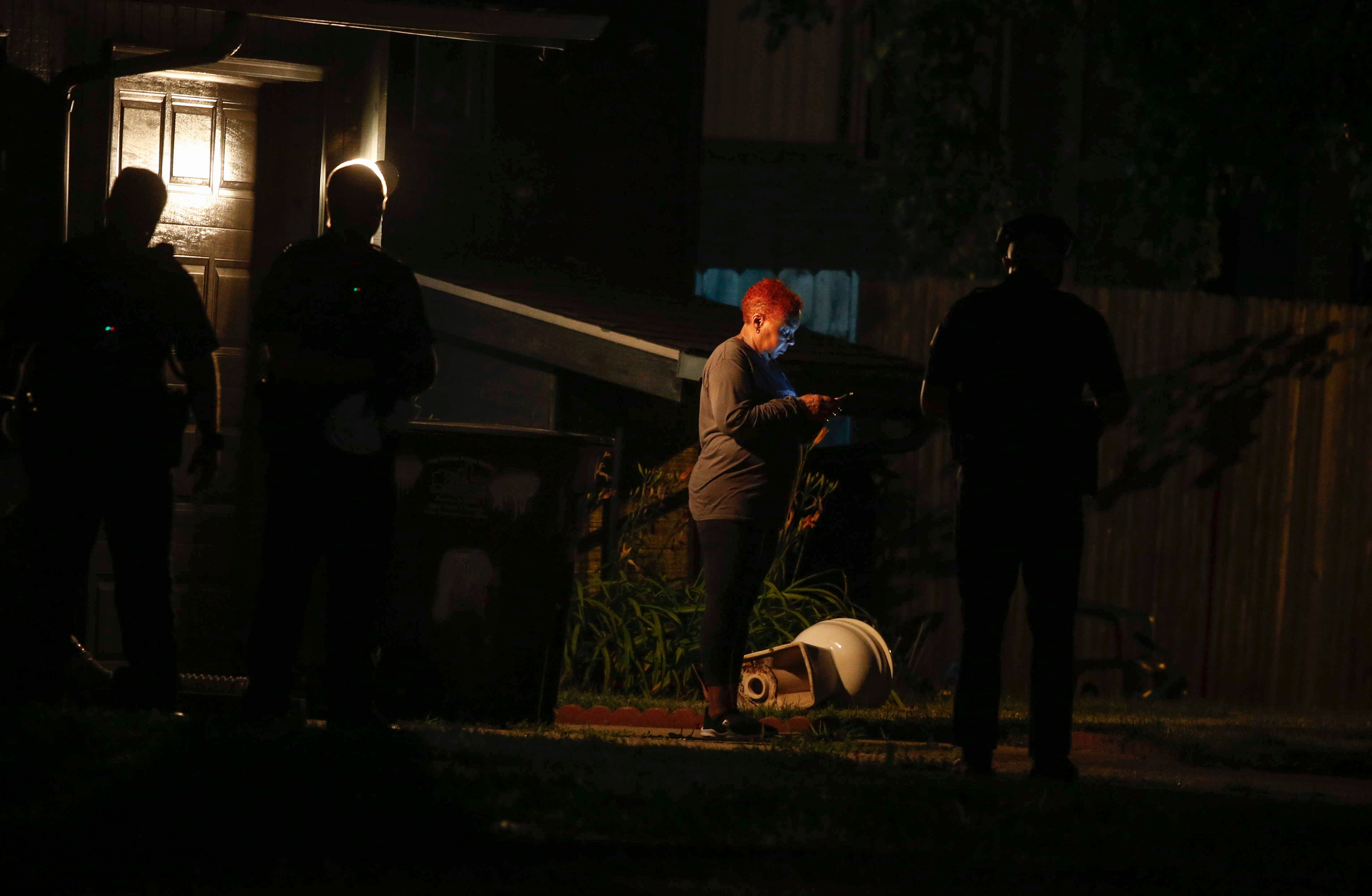Des Moines police work the scene at a home on Day Street where multiple people were found deceased late on Tuesday, July16, 2019.