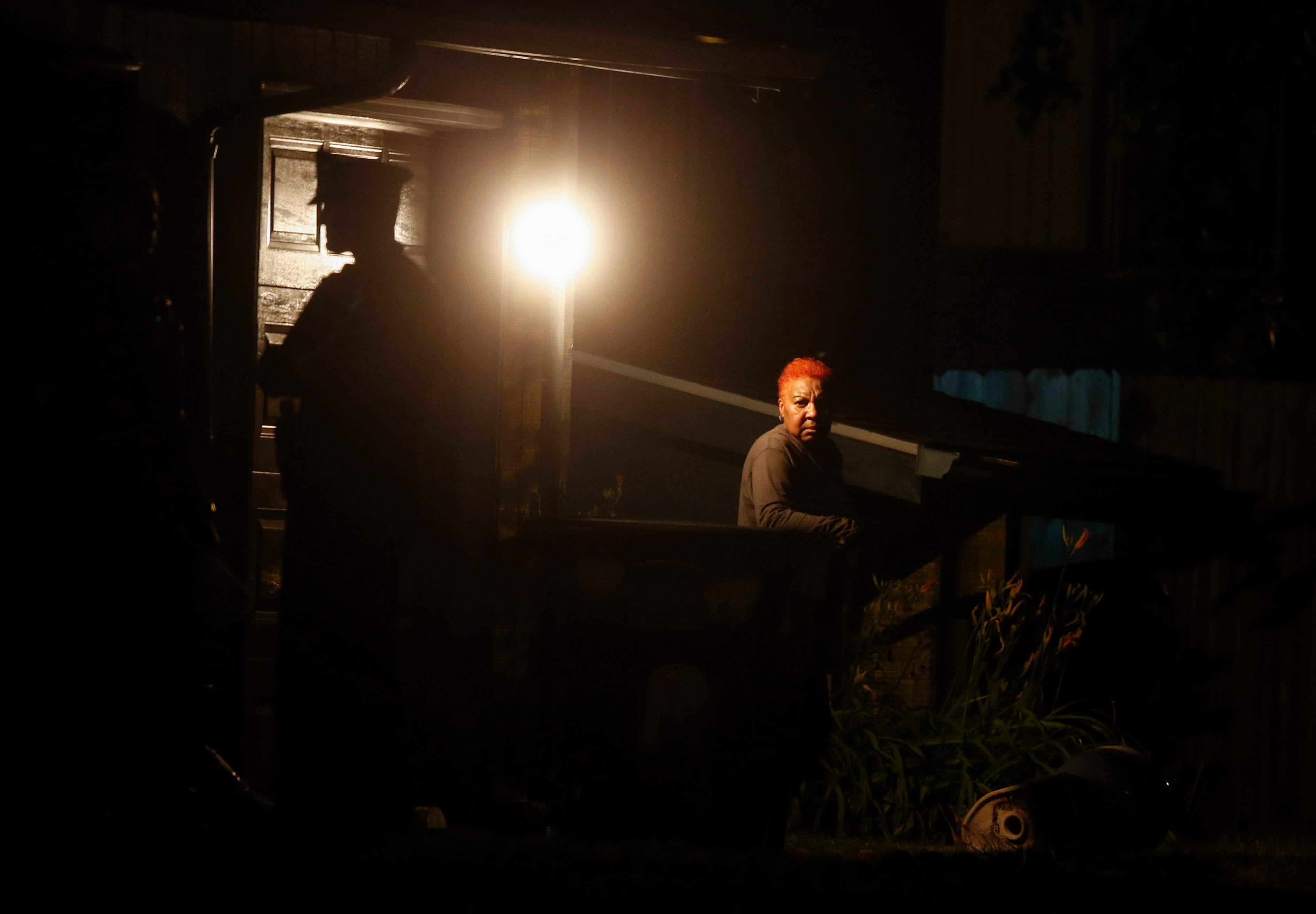 Des Moines police work the scene at a home on Day Street where multiple people were found deceased late on Tuesday, July16, 2019.