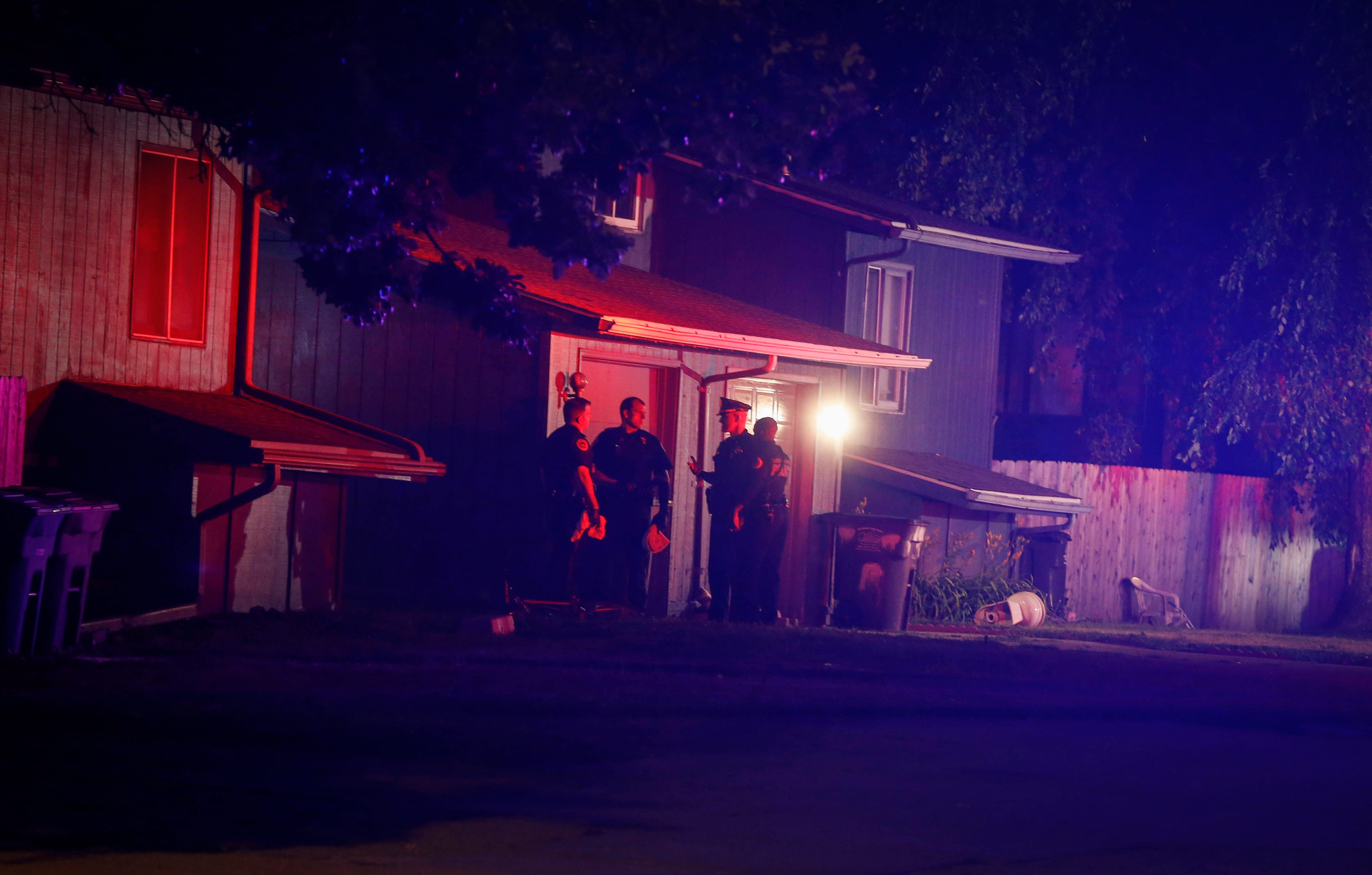 Des Moines police work the scene at a home on Day Street where multiple people were found deceased late on Tuesday, July16, 2019.