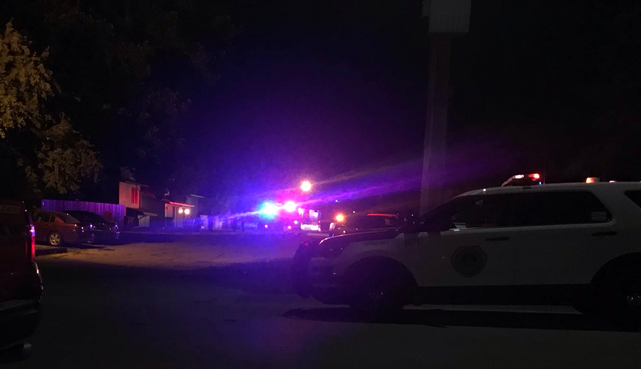 Police vehicles are parked out the scene of a suspected shooting just north of downtown De sMoines late on Tuesday, July 16, 2019.