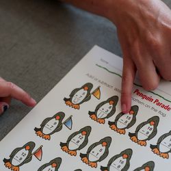 Amy Watts helps her daughter, Nora, 6, with a math worksheet as she prepares for the coming school year at their home in Lehi, Utah, on Saturday, Aug. 17, 2019.