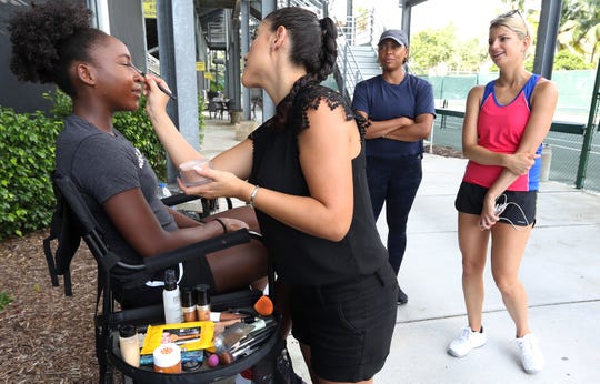 Coco Gauff preps for a shoot between workouts at Delray Beach Tennis Center.