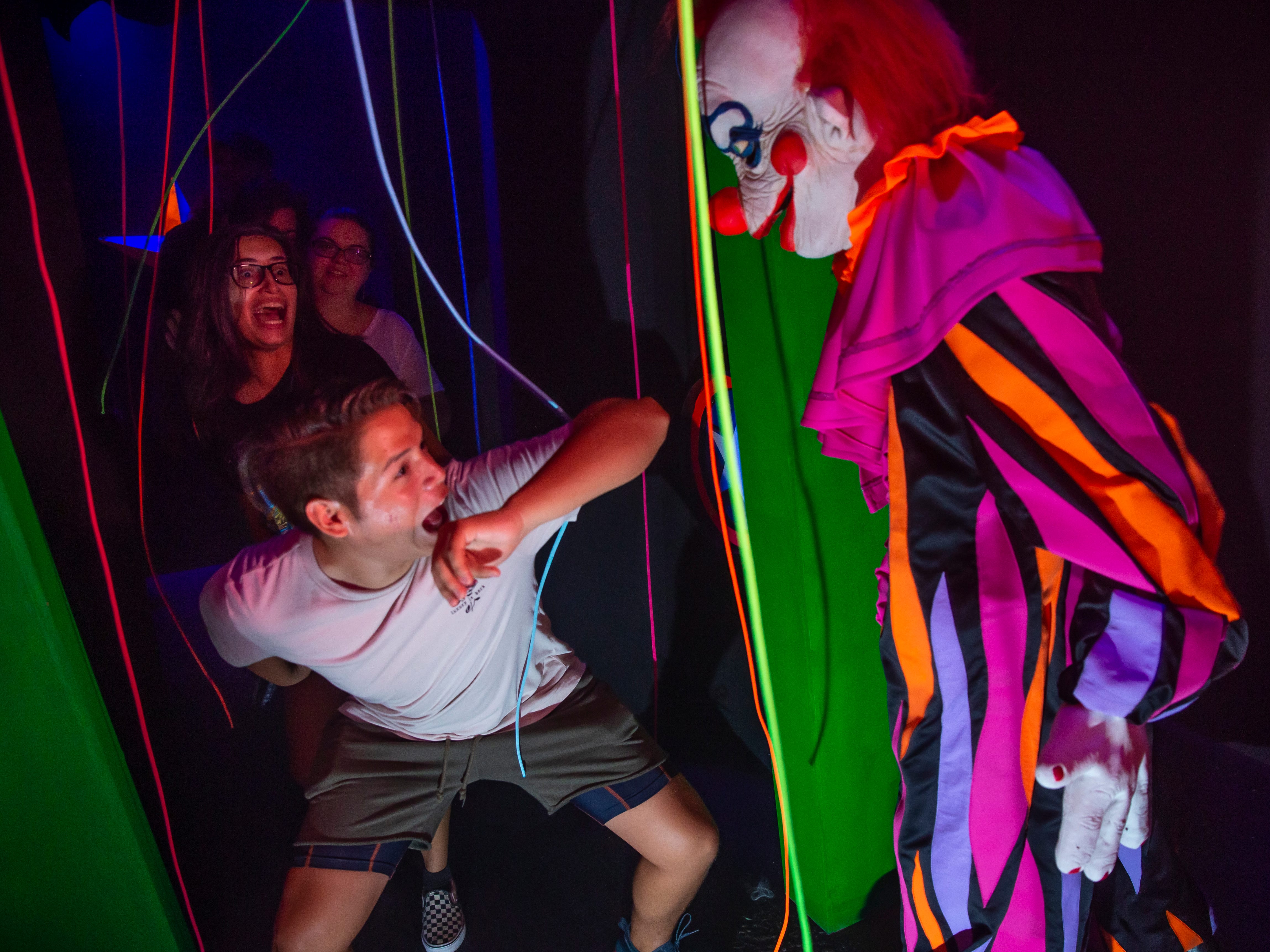 You'd be wise to face your fear of clowns before hitting up the Killer Klowns From Outer Space Halloween Horror Night House (available at both parks).