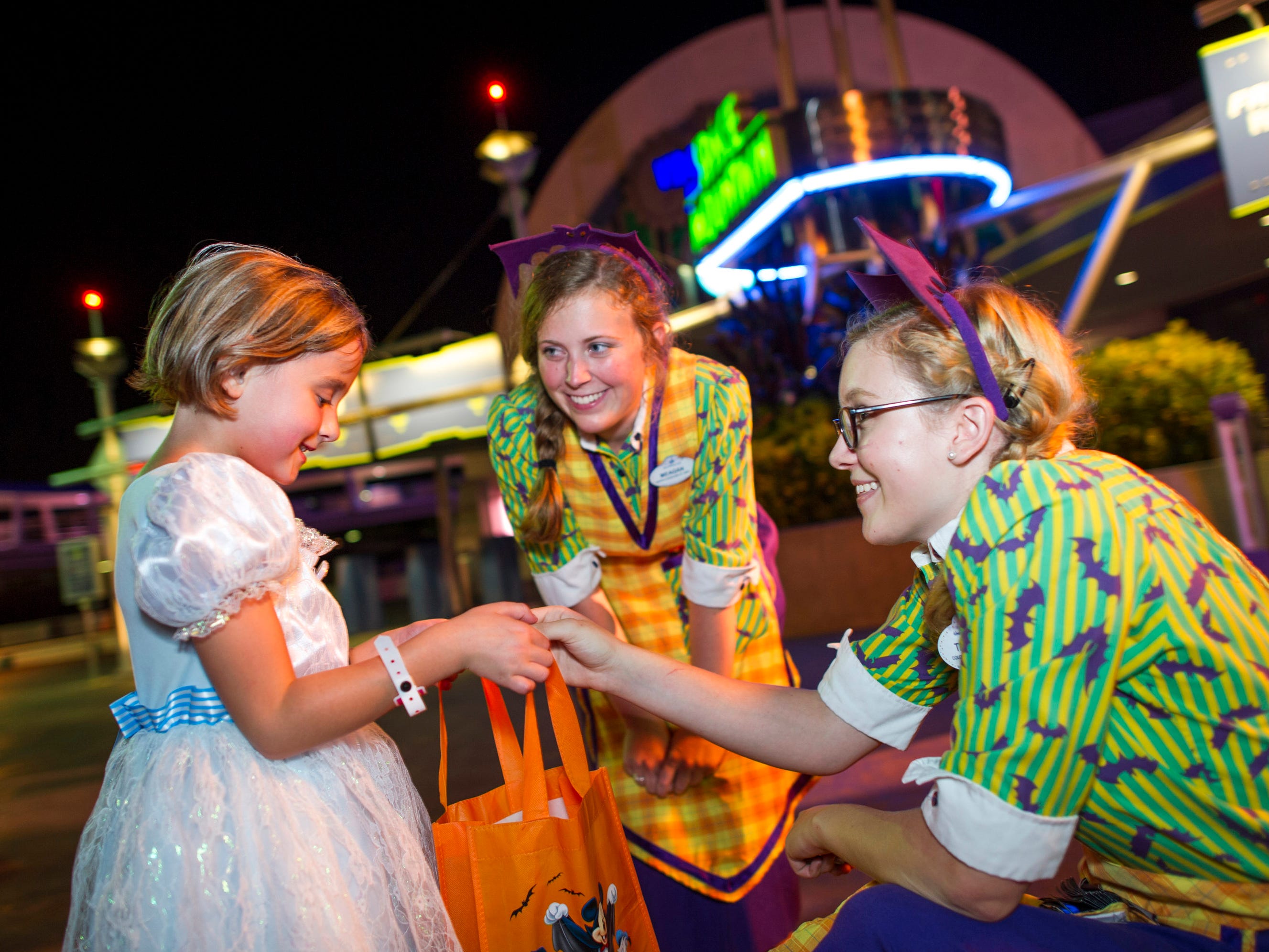 Kids of all ages get into the Happy Halloween spirit while trick-or-treating during Mickey's Not-So-Scary Halloween Party at the Magic Kingdom.