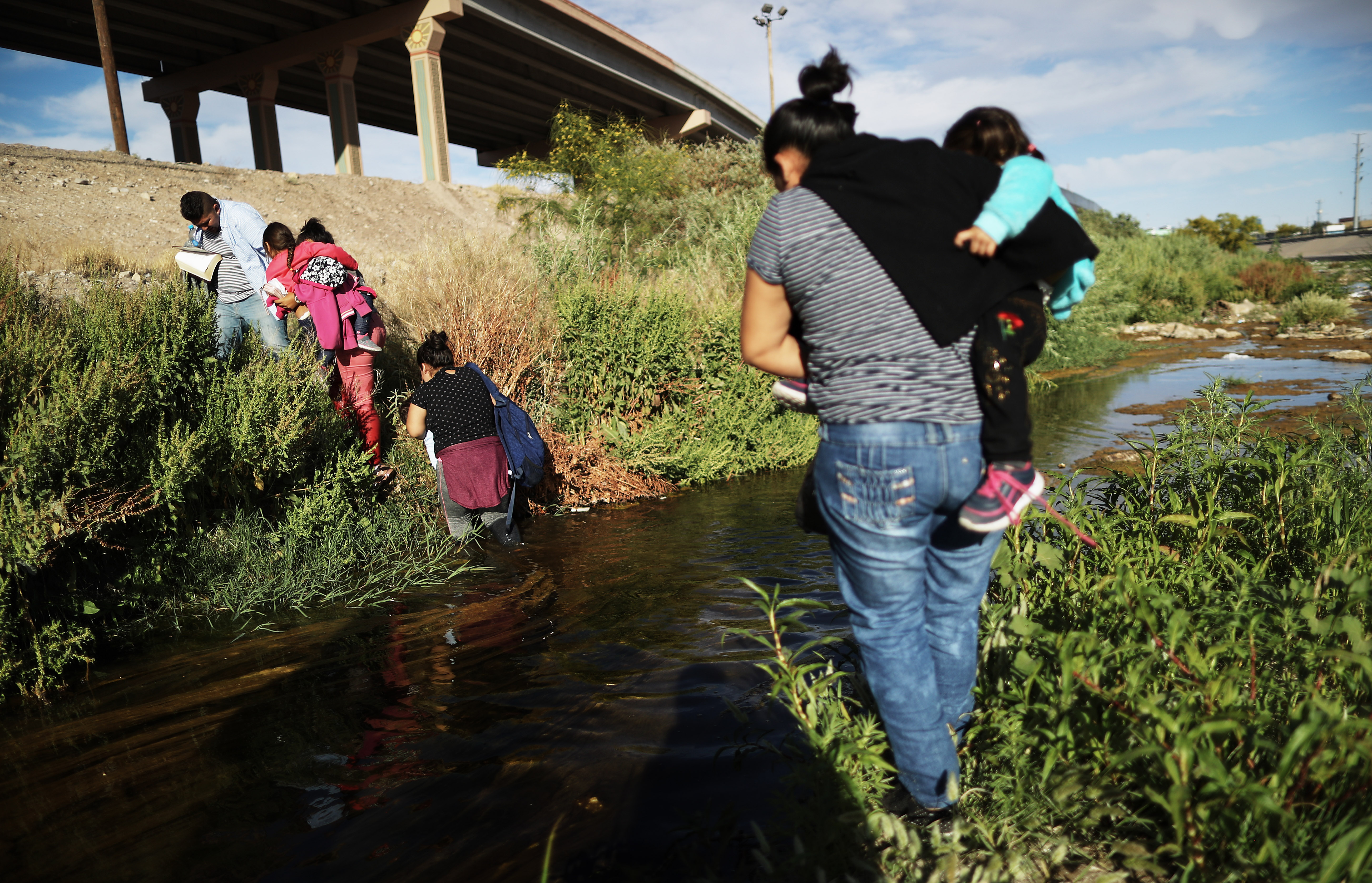 Migrants cross the border between the U.S. and Mexico at the Rio Grande river, as they walk to enter El Paso, Texas, on May 19, 2019 as taken from Ciudad Juarez, Mexico.