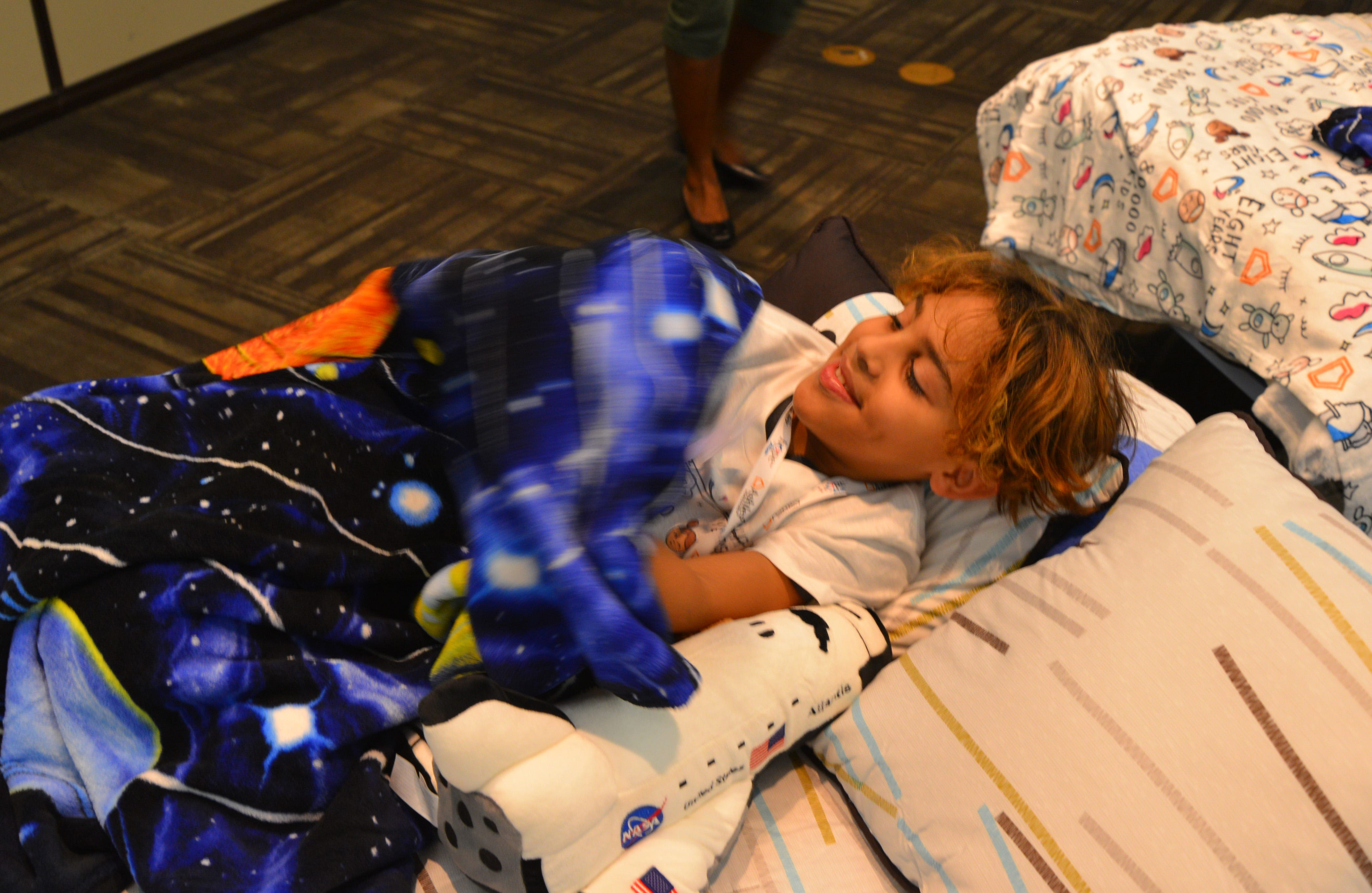50 students from four Brevard schools were invited to Kennedy Space Center Visitor Complex Friday afternoon for the Ashley HomeStoreâ€™s national â€œHope to Dreamâ€ program to surprise 50 children an afternoon at the Kennedy Space Center Visitor Complex, followed by a mass bed reveal, where kids will receive their very own bed. Children will receive a twin mattress, bed frame, pillow, comforter, mattress protector, swag bag and teddy bear. These children do not have their own bed, they either share with their parent or siblings, sleep on the sofa or on the floor. Ashley's HomeStore Hope to Dream program has given out 90,000 beds since 2010. 