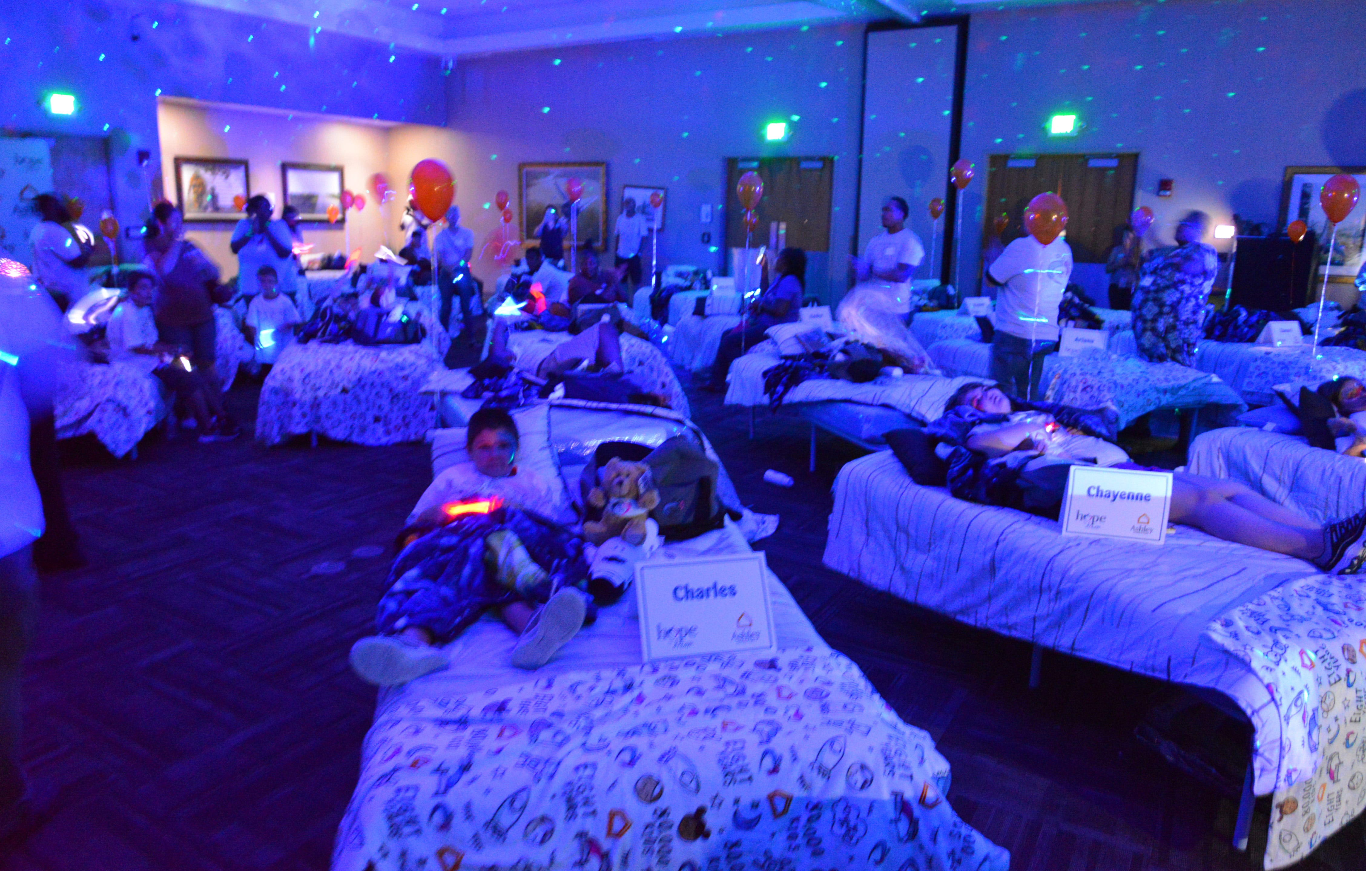 50 students from four Brevard schools were invited to Kennedy Space Center Visitor Complex Friday afternoon for the Ashley HomeStoreâ€™s national â€œHope to Dreamâ€ program to surprise 50 children an afternoon at the Kennedy Space Center Visitor Complex, followed by a mass bed reveal, where kids will receive their very own bed. Children will receive a twin mattress, bed frame, pillow, comforter, mattress protector, swag bag and teddy bear. These children do not have their own bed, they either share with their parent or siblings, sleep on the sofa or on the floor. Ashley's HomeStore Hope to Dream program has given out 90,000 beds since 2010. 
