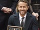 Actor Ryan Reynolds poses after receiving a star on