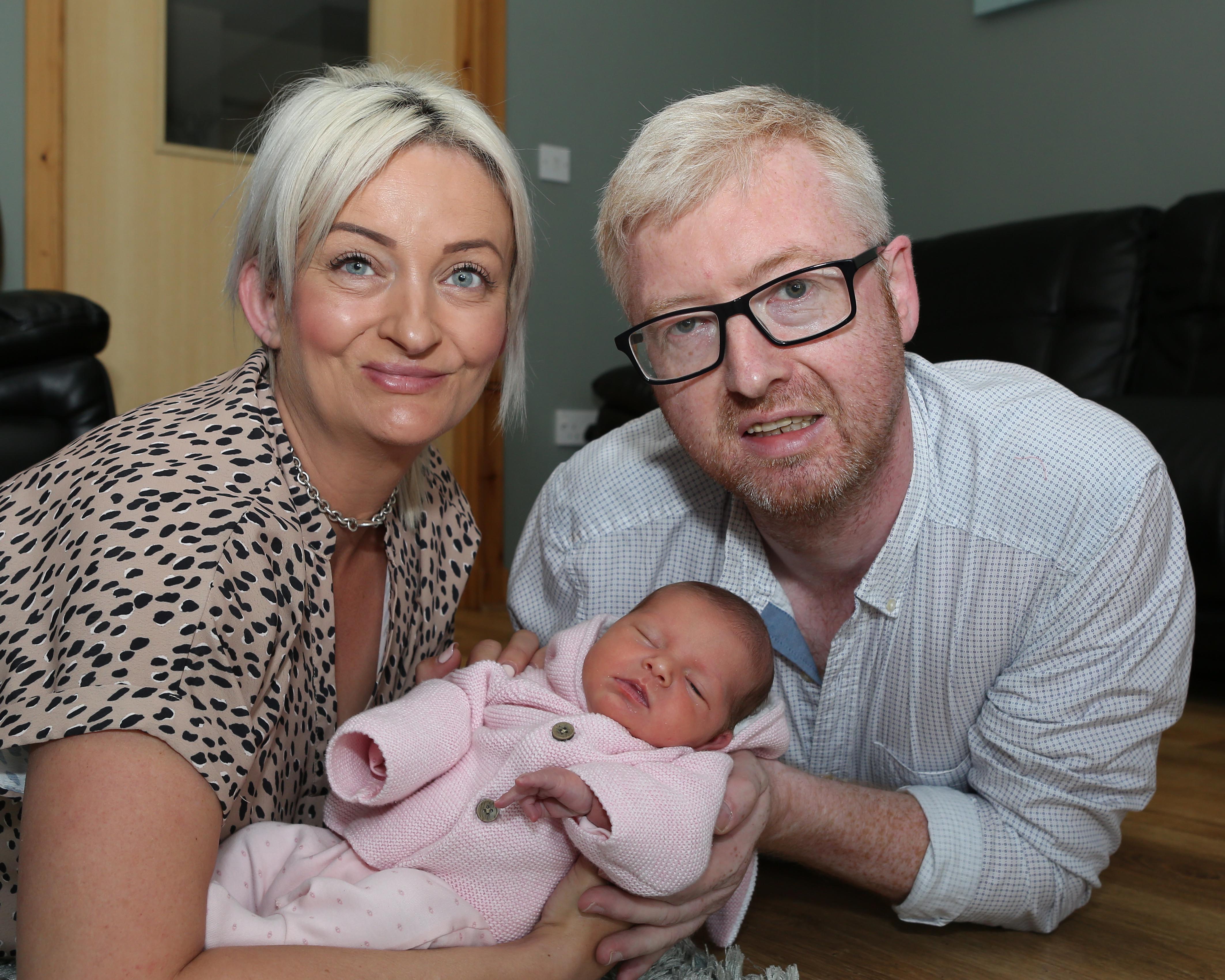 Alexis Brett, her husband Davie and baby Cameron - a girl.