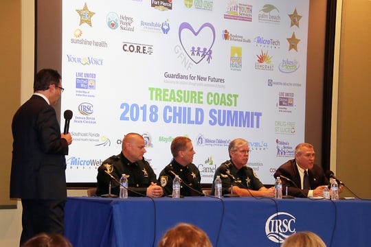 WPTV NewsChannel 5's Jon Shainman, left, facilitates of panel of law enforcement representatives from Martin, Okeechobee, Indian River and St. Lucie counties.