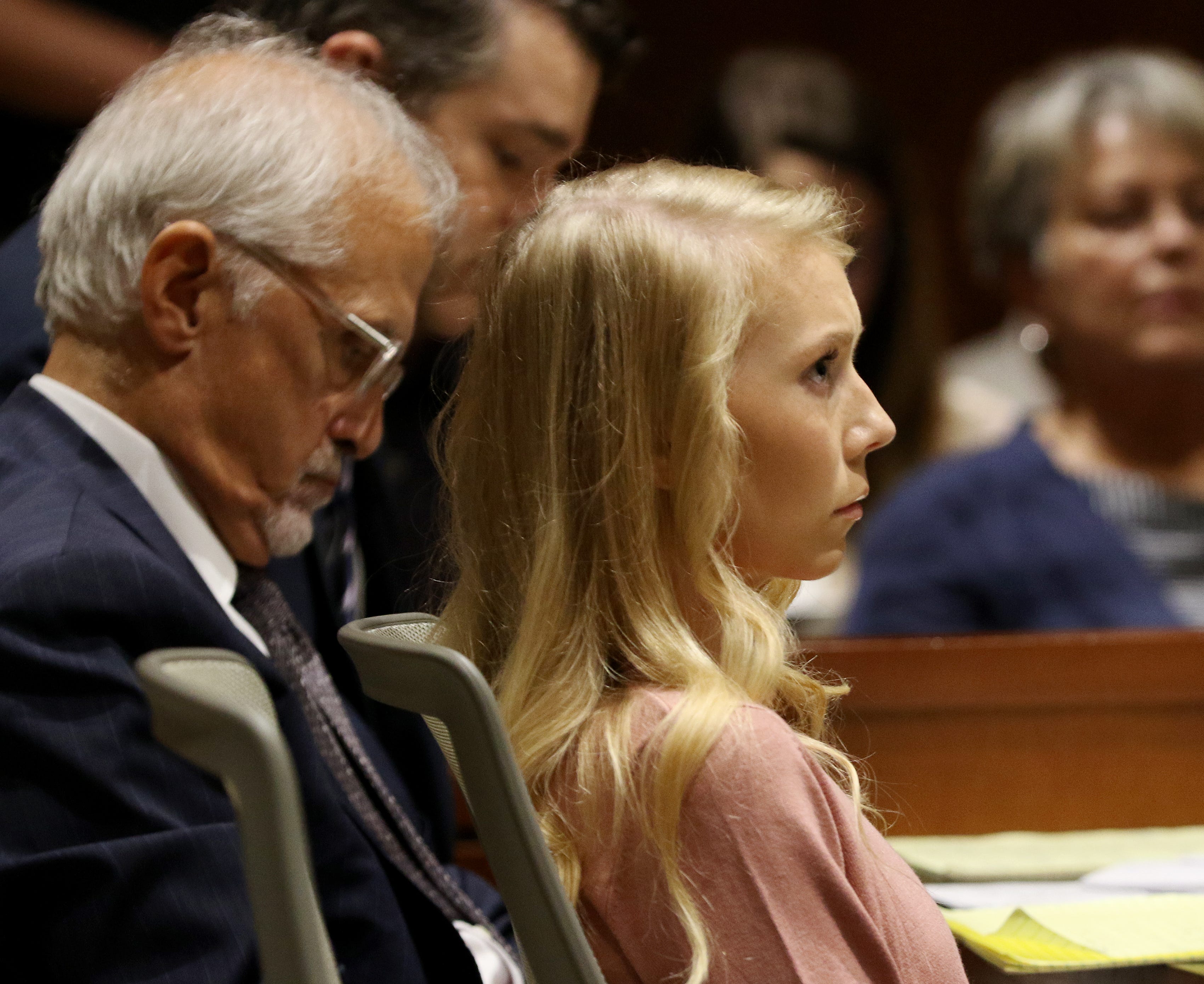 Brooke "Skylar" Richardson, sits with one of her attorneys, Charlie H. Rittgers as her other attorney Charlie M. Rittgers makes a statement to the potential jurors at the Warren County Courthouse Tuesday, September 3, 2019. Richardson, 20, is accused of killing and burying her baby in the backyard of her Carlisle home. Richardson is charged with aggravated murder, involuntary manslaughter, gross abuse of a corpse, tampering with evidence and child endangerment in the death of her newborn infant.