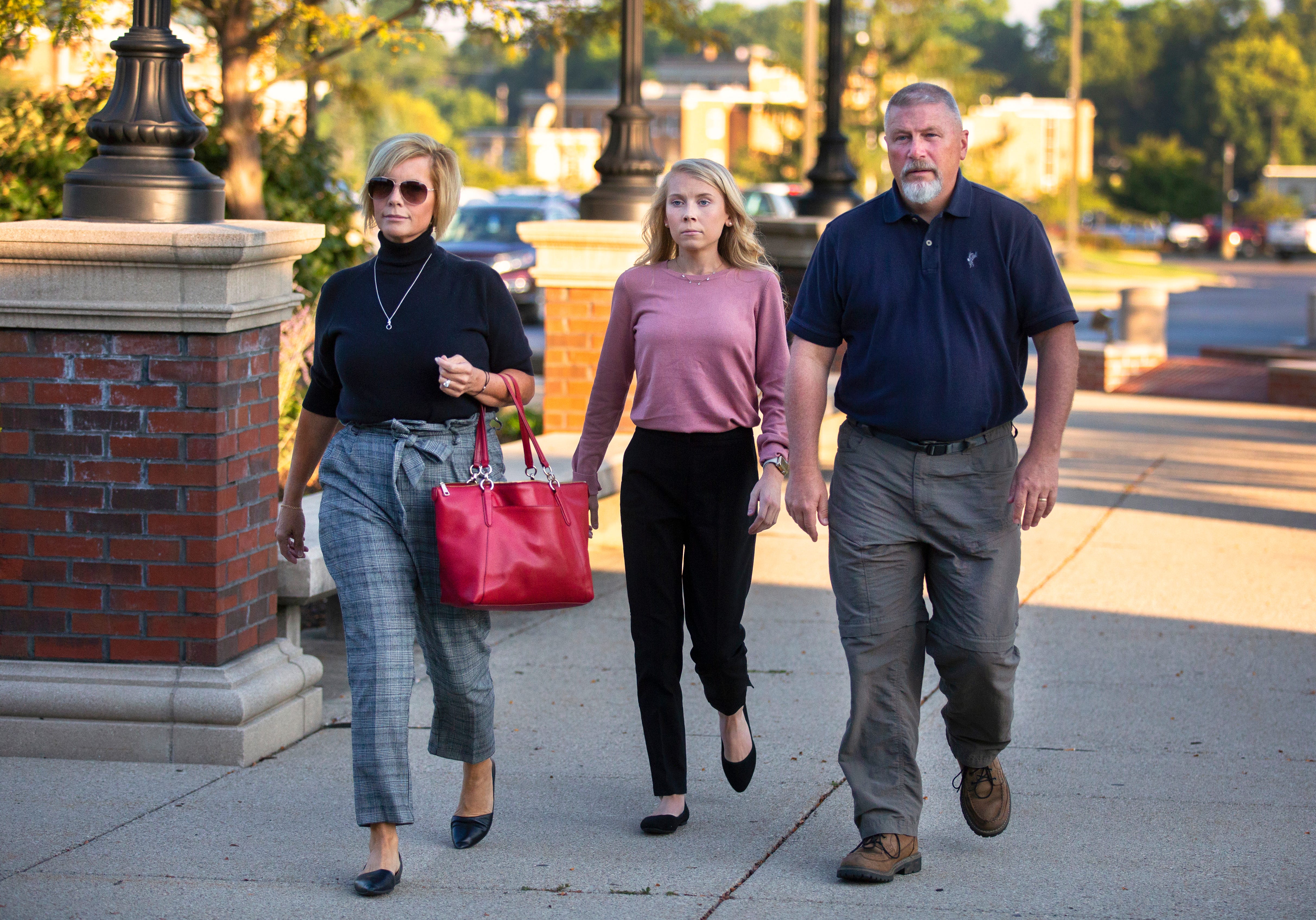 Brooke 'Skylar' Richardson, 20, walks into the Warren County Courthouse in Lebanon, Ohio, Tuesday, Sept. 3, with her parents, Kim and Scott Richardson, of Carlisle. Richardson is charged with aggravated murder, involuntary manslaughter, gross abuse of a corpse, tampering with evidence and child endangerment in the death of her newborn infant. She faces the possibility of life in prison. She was 18 at that time.