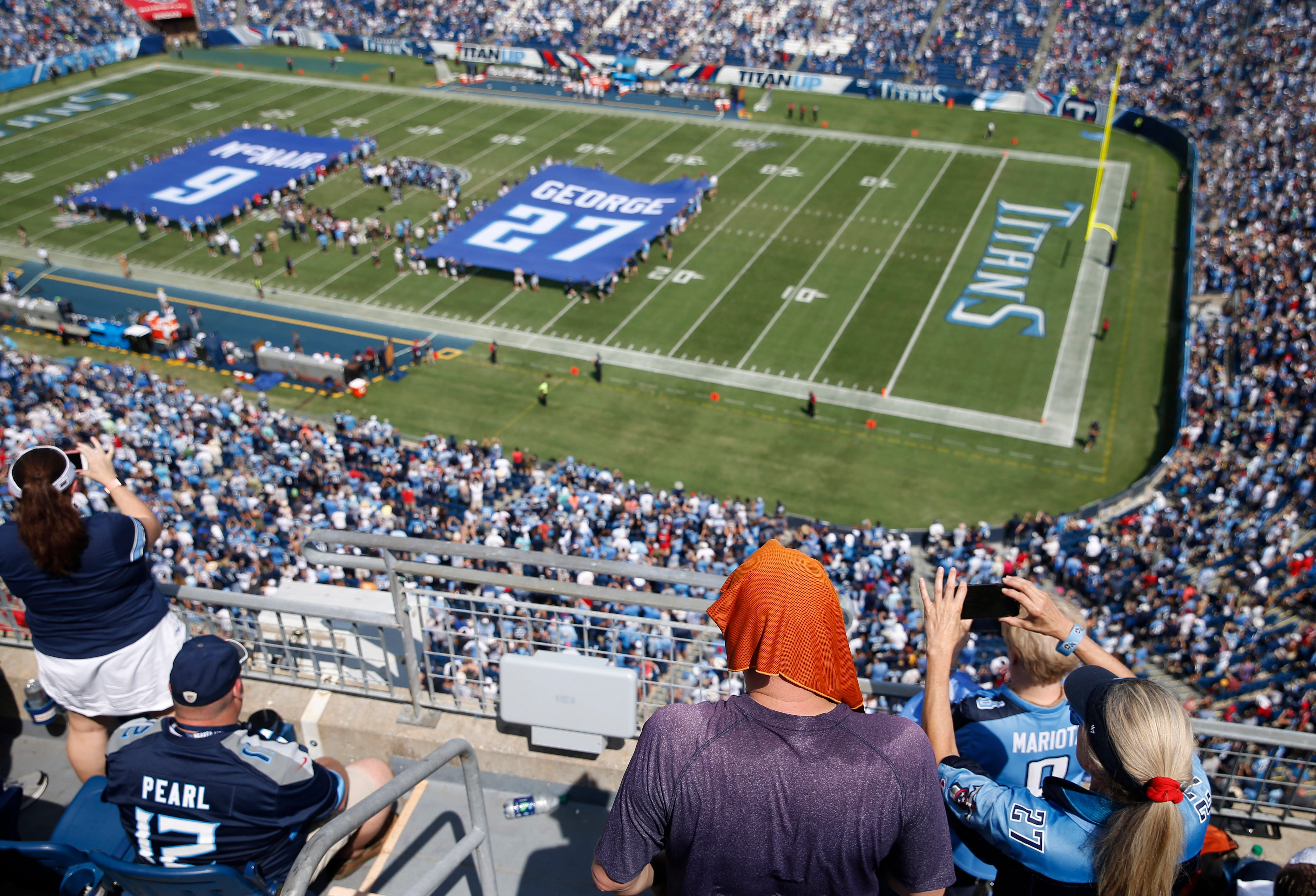 Jersey numbers for former Tennessee Titans stars Steve McNair and Eddie George are retired during a halftime ceremony at Nissan Stadium Sunday, Sept. 15, 2019 in Nashville, Tenn. 