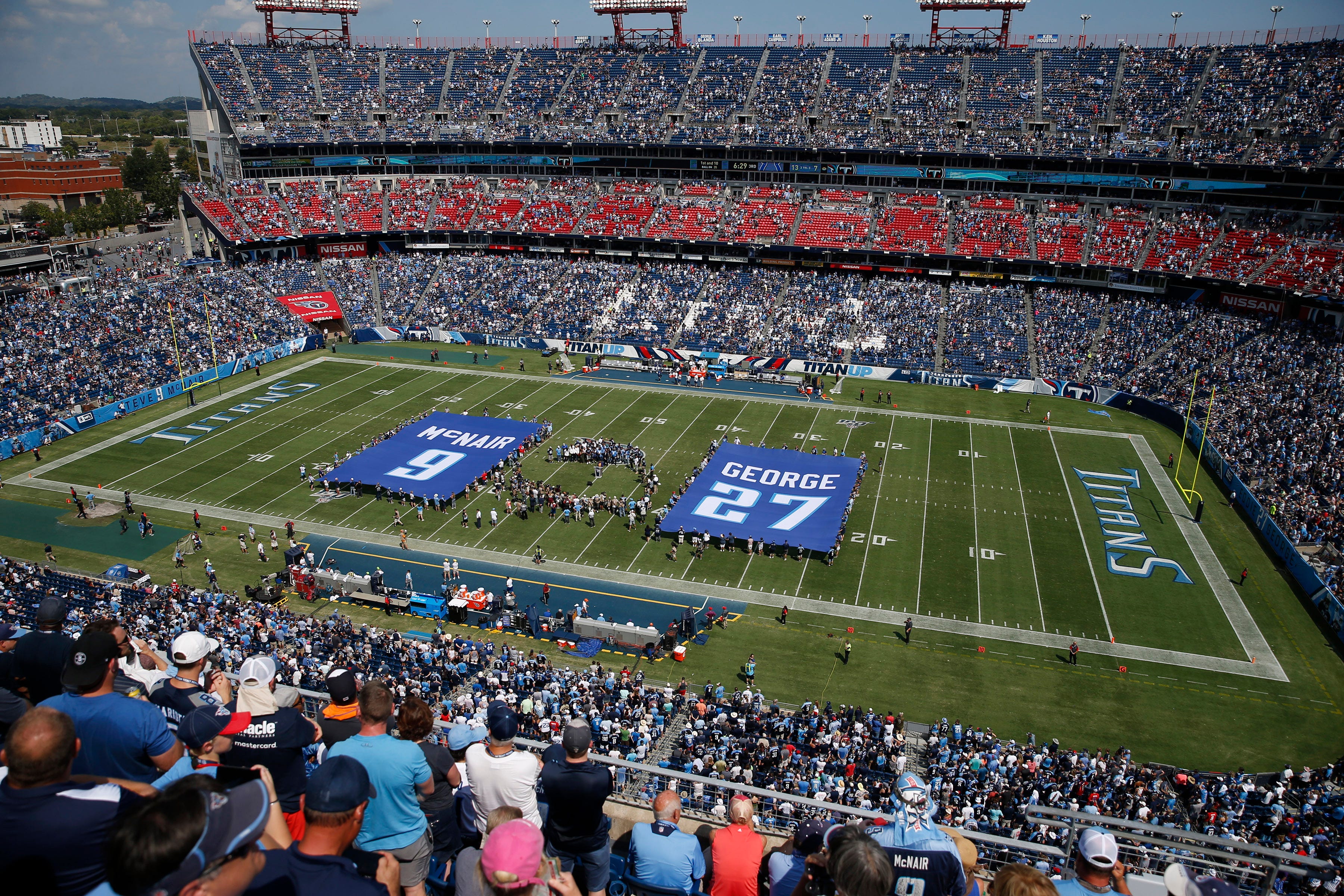 Jersey numbers for former Tennessee Titans stars Steve McNair and Eddie George are retired during a halftime ceremony at Nissan Stadium Sunday, Sept. 15, 2019 in Nashville, Tenn. 