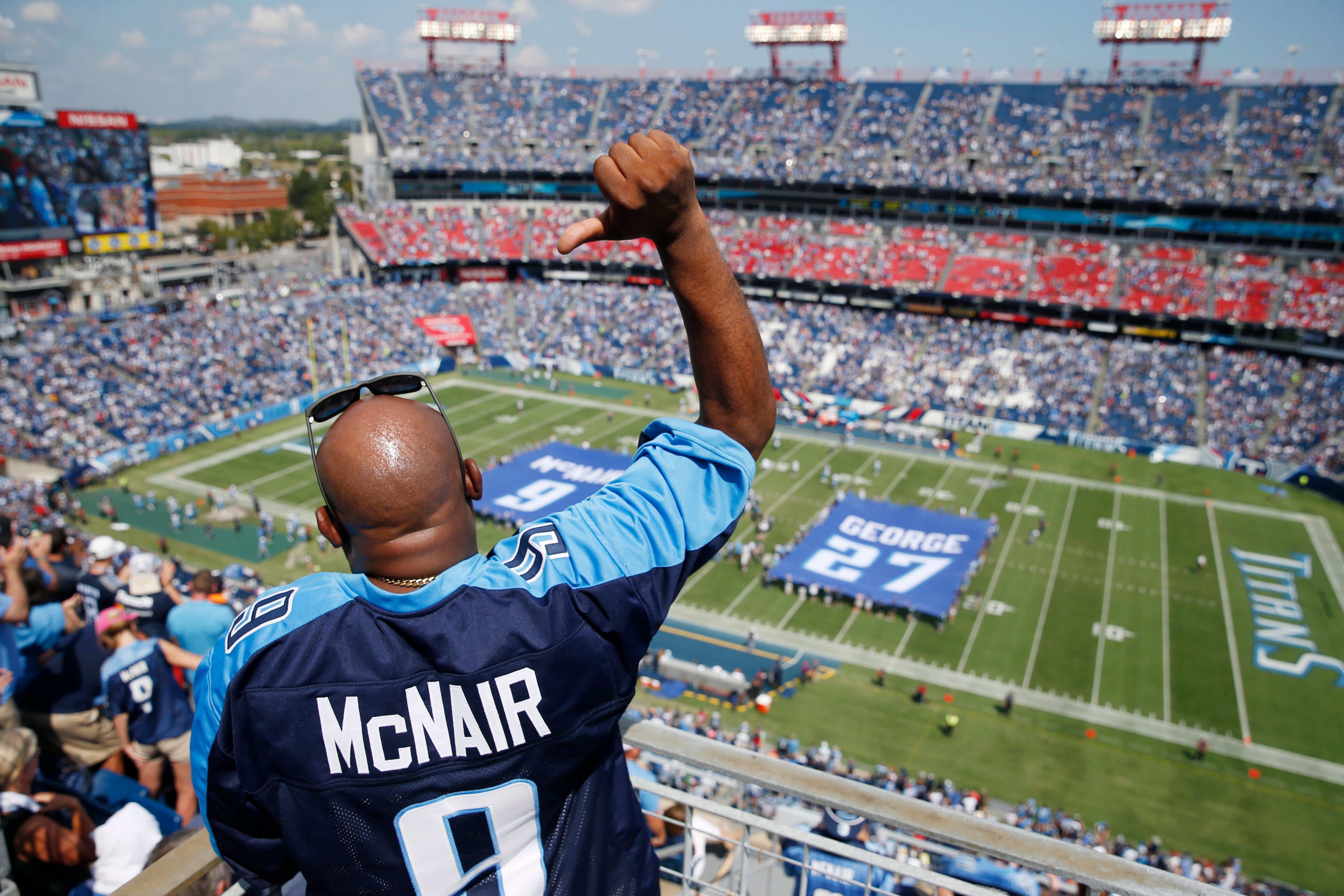 Jersey numbers for former Tennessee Titans stars Steve McNair and Eddie George are retired during a halftime ceremony at Nissan Stadium Sunday, Sept. 15, 2019 in Nashville, Tenn. 