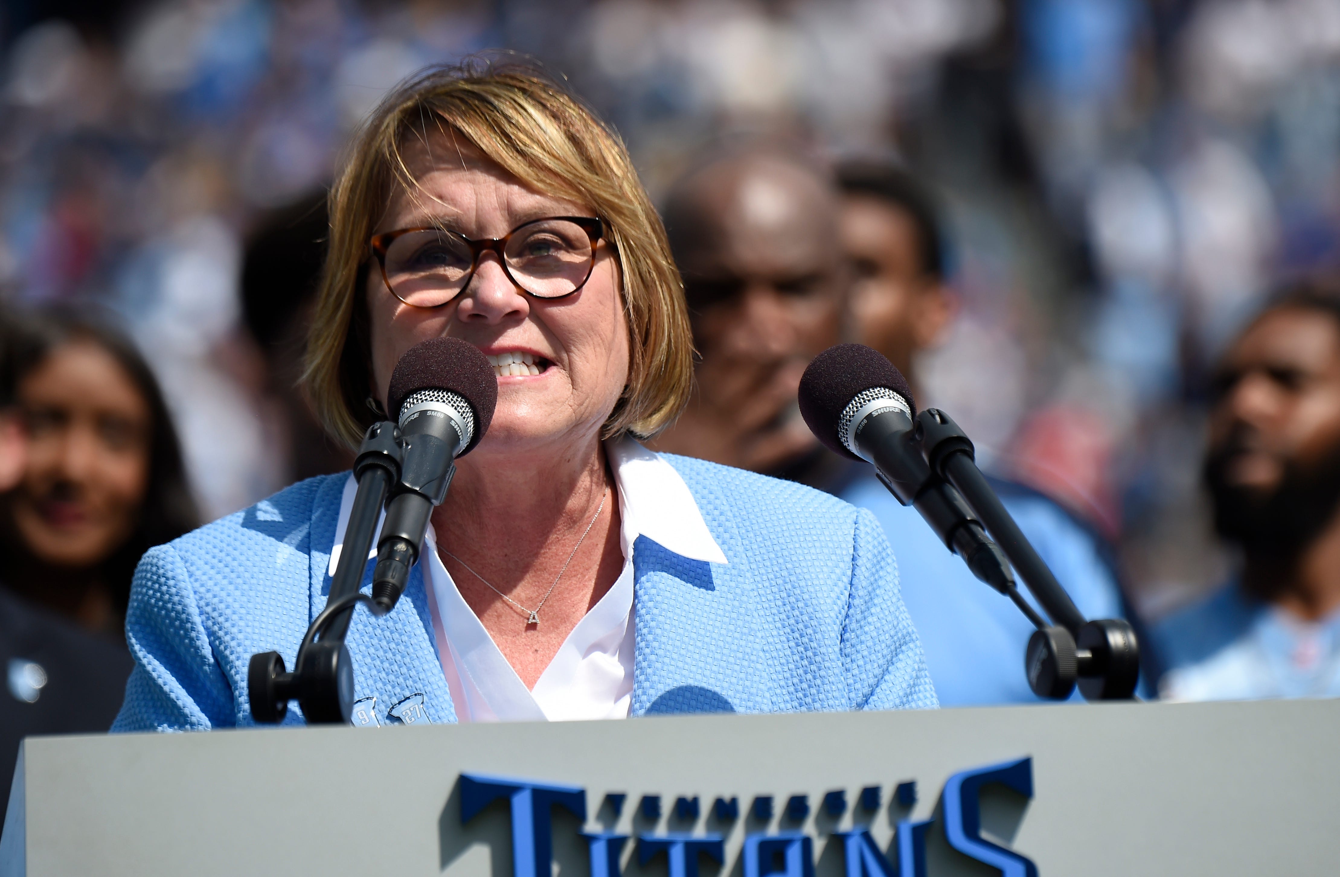 Titans owner Amy Adams Strunk speaks during halftime ceremonies during retire the jersey numbers of Titans greats Eddie George and Steve McNair at Nissan Stadium Sunday, Sept. 15, 2019 in Nashville, Tenn. 