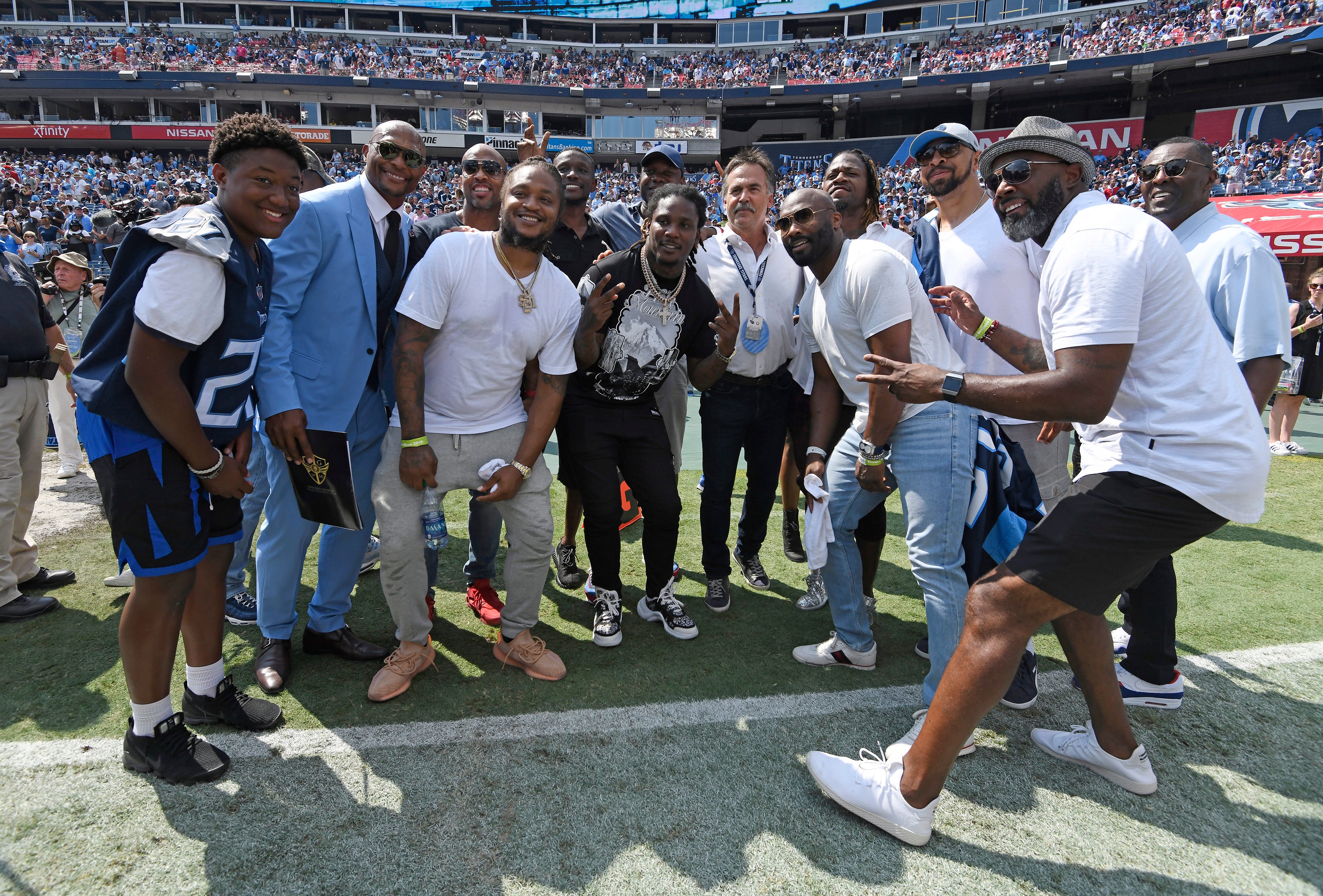 Former Titans stars pose for a group photo after halftime ceremonies at Nissan Stadium Sunday, Sept. 15, 2019 in Nashville, Tenn. 