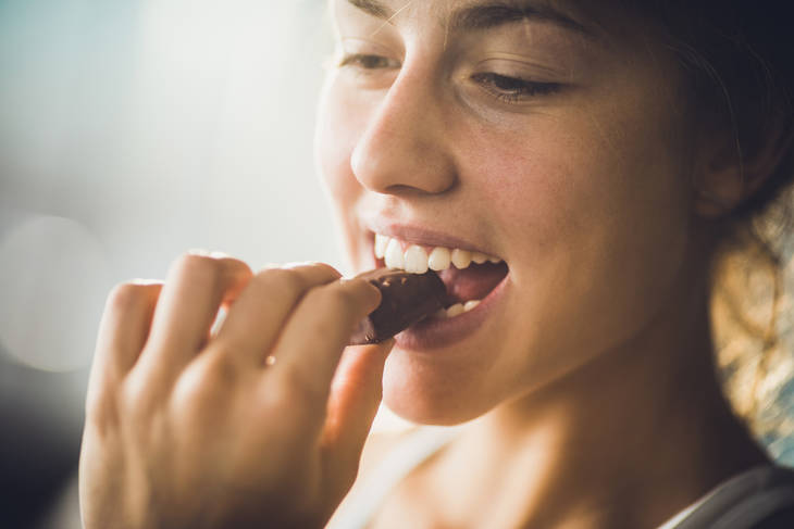 woman eating chocolate