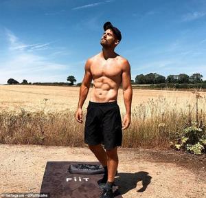 a man standing on a dirt road: The Fiit Trainer is now one of 20 PT's on the home workout app. Pictured: Before a workout in the sun