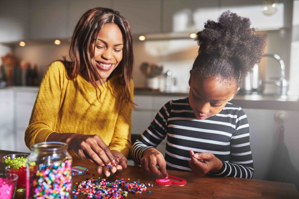 Mother and daughter do crafts