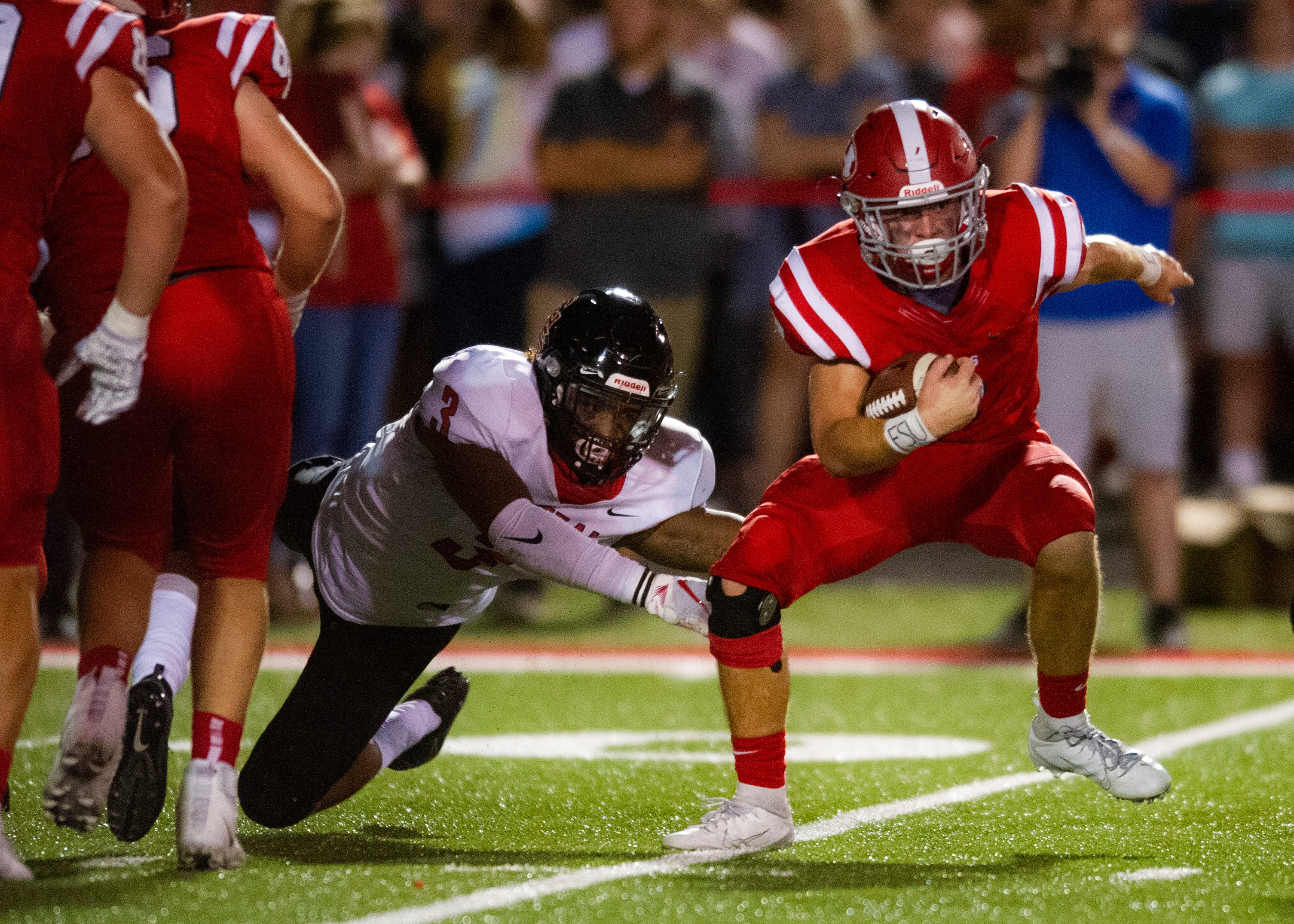Central's Eunique Valentine (3) fails to grab Halls' Jake Parris (8) during the Halls and Central high school football game on Friday, October 4, 2019 at Halls High School.