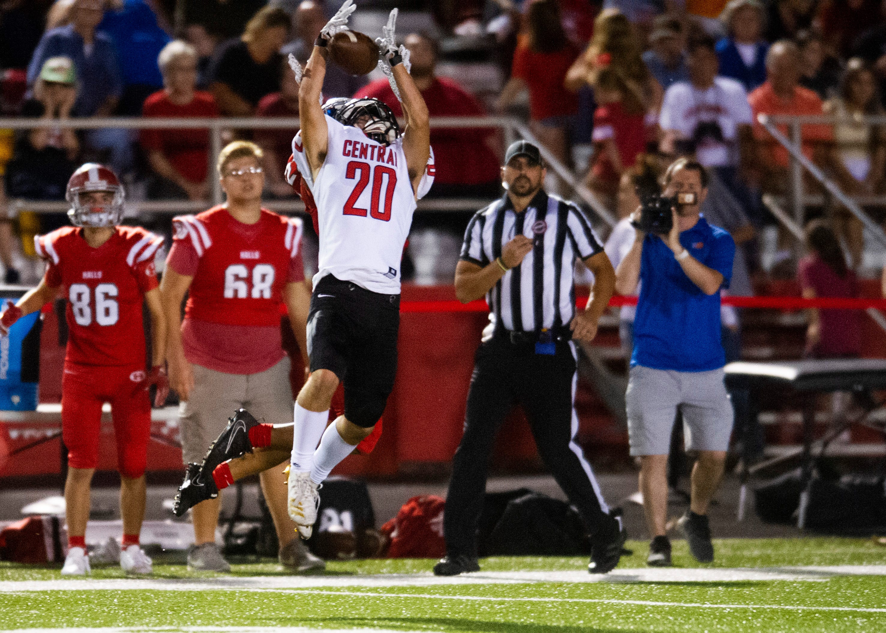 Central's Conner Williamson (20) attempts to intercept the ball during the Halls and Central high school football game on Friday, October 4, 2019 at Halls High School.