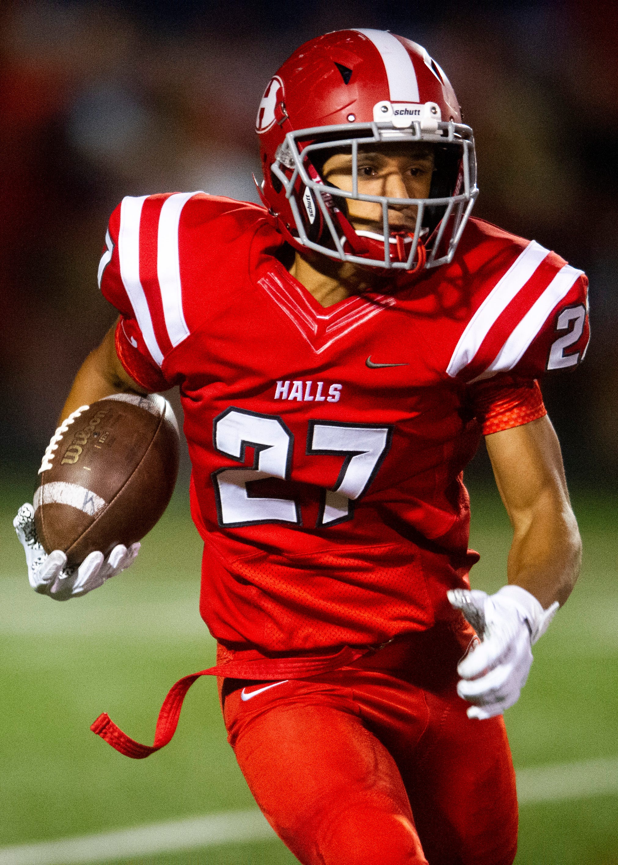 Halls' Tae Rucker (27) runs with the ball during the Halls and Central high school football game on Friday, October 4, 2019 at Halls High School.