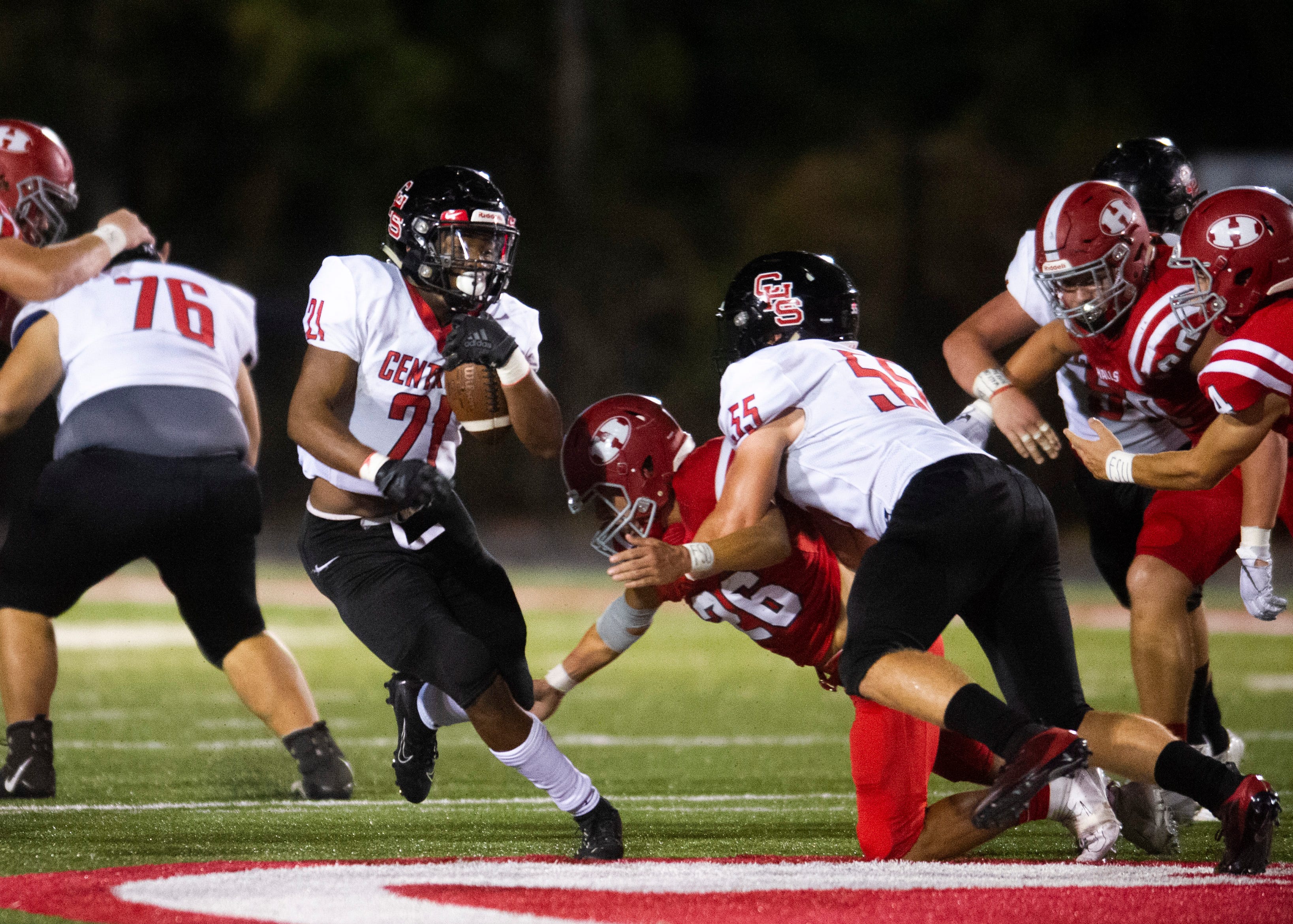 Central's Makhi Anderson (21) runs past Halls' defense during the Halls and Central high school football game on Friday, October 4, 2019 at Halls High School.