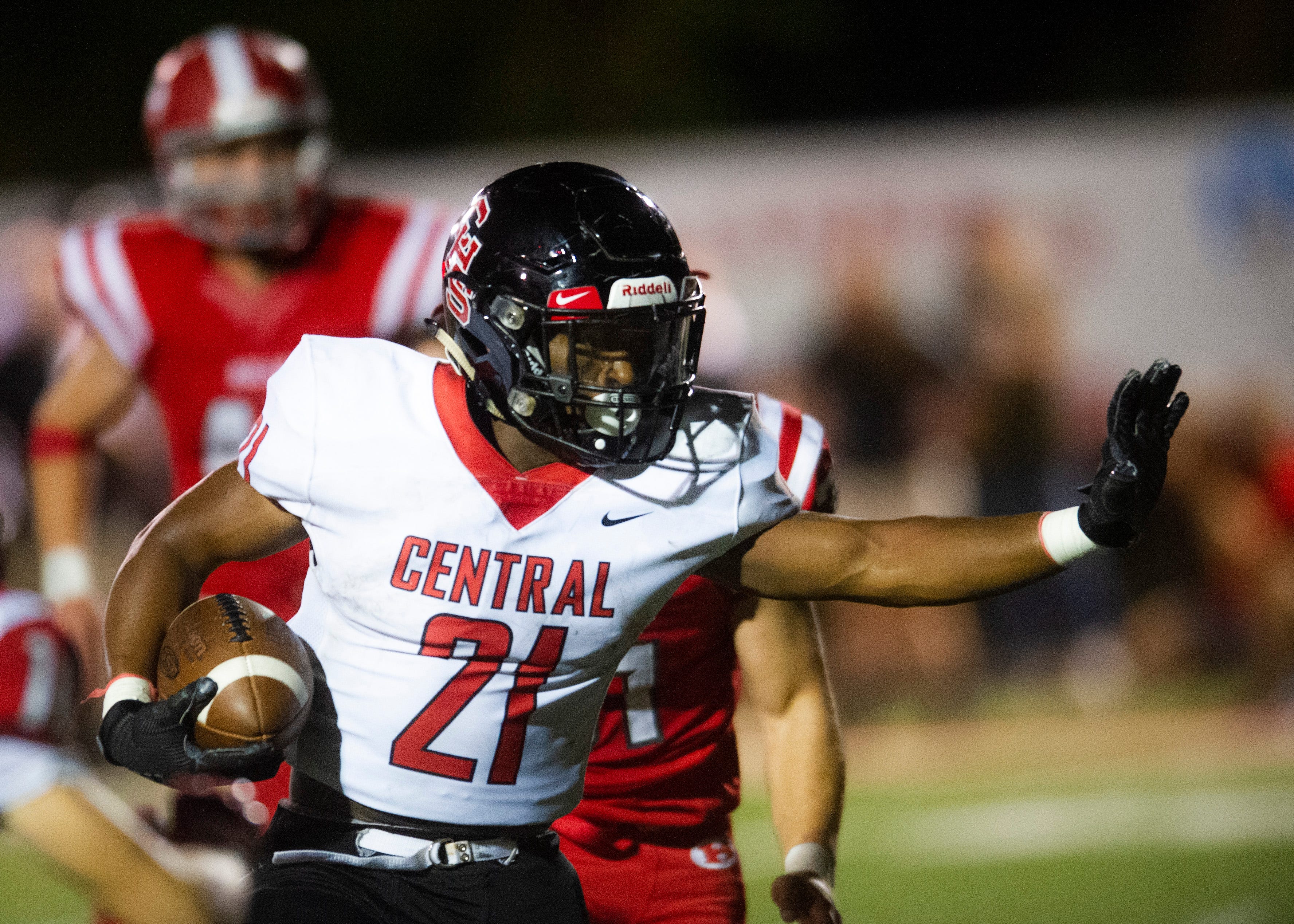 Central's Makhi Anderson (21) prepares to push away players during the Halls and Central high school football game on Friday, October 4, 2019 at Halls High School.