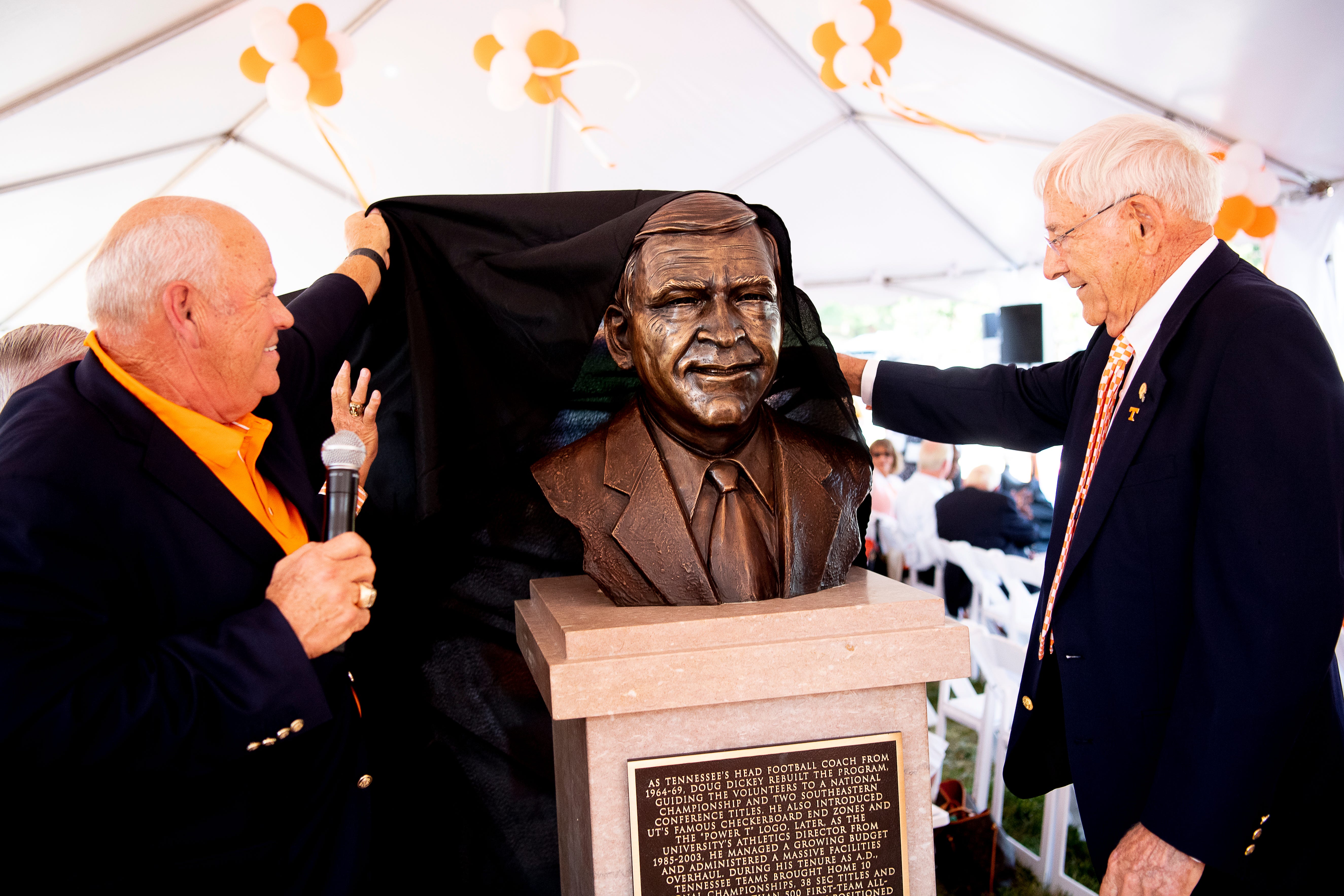 Phillip Fulmer and Doug Dickey unveil a bust of Dickey during a dedication ceremony of the Doug Dickey Hall of Fame Plaza at the Neyland-Thompson Sports Complex in Knoxville, Tennessee on Friday, October 4, 2019. Dickey led UT to its second SEC title in 1969 and served as the Vols' Director of Athletics from 1986 to 2003.