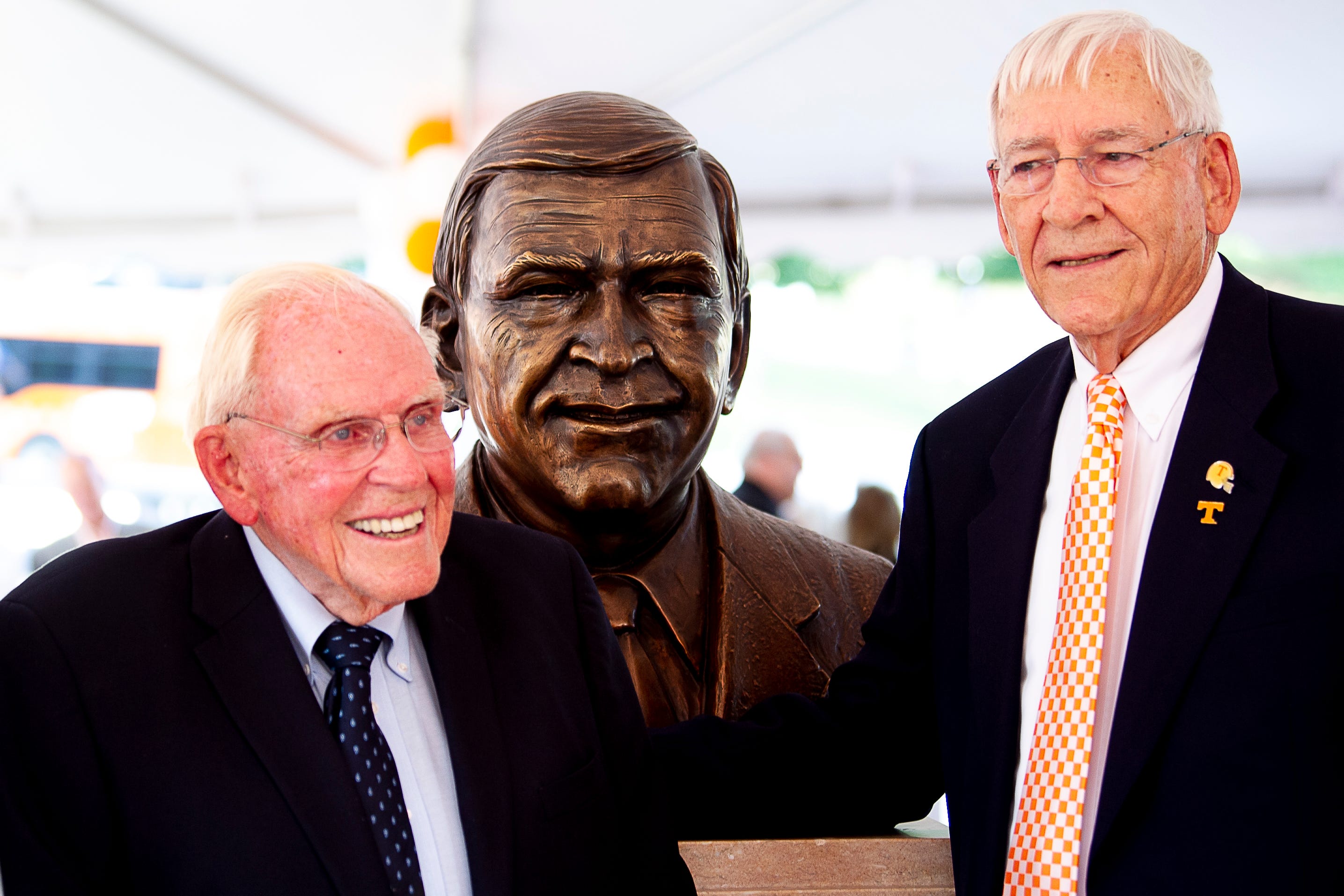 Former SEC commissioner Roy Kramer and former Tennessee coach and athletic director Doug Dickey stand beside a newly unveiled bust of him during a dedication ceremony of the Doug Dickey Hall of Fame Plaza at the Neyland-Thompson Sports Complex in Knoxville, Tennessee on Friday, October 4, 2019. Dickey led UT to its second SEC title in 1969 and served as the Vols' Director of Athletics from 1986 to 2003.