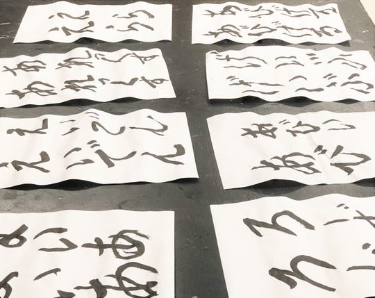 Samples of Japanese calligraphy are put to the side to dry during the Japanese Club meeting at South-Doyle Middle School on Oct. 1.2019