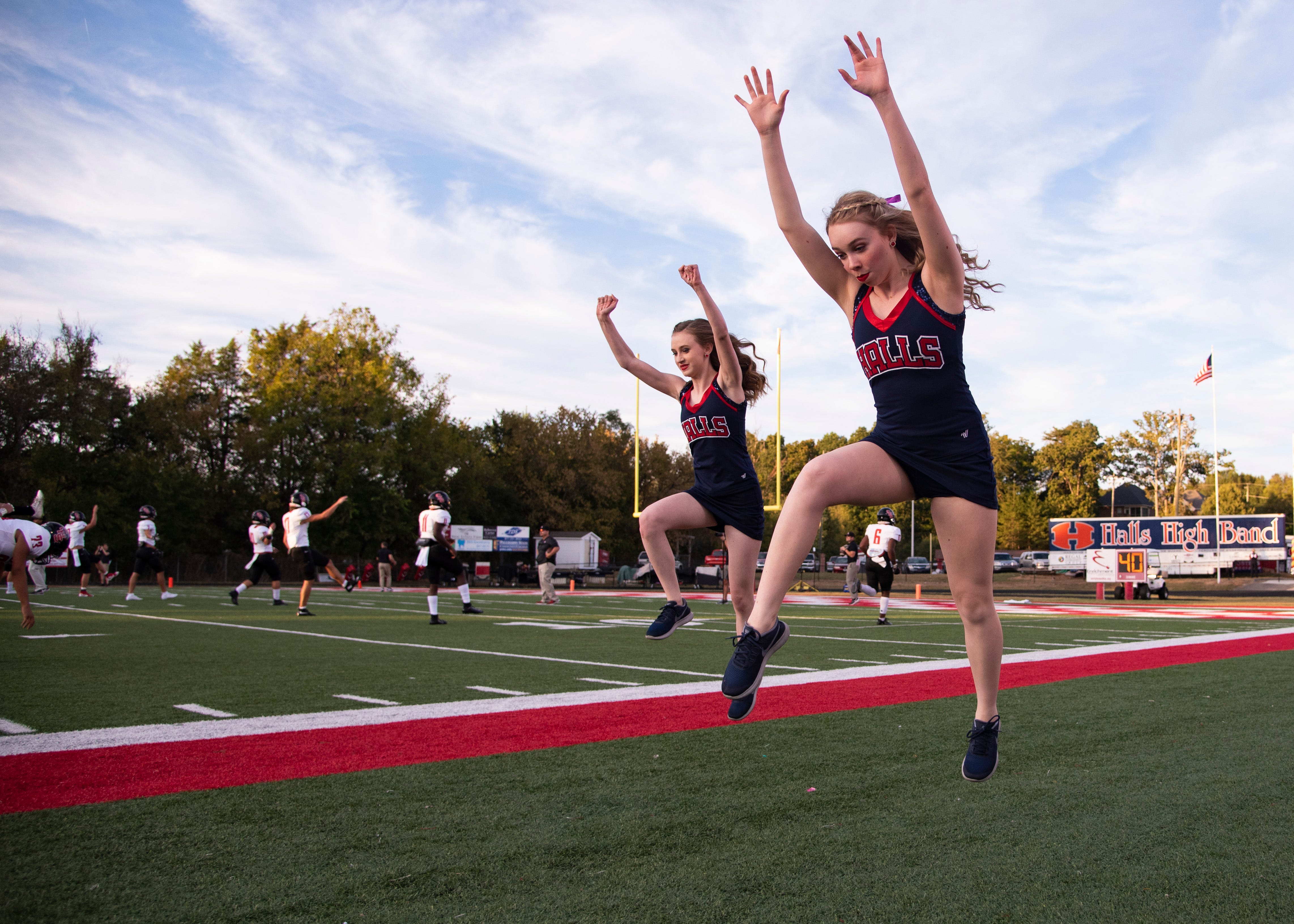 Halls dance team members practice their moves before the Halls and Central high school football game on Friday, October 4, 2019 at Halls High School.