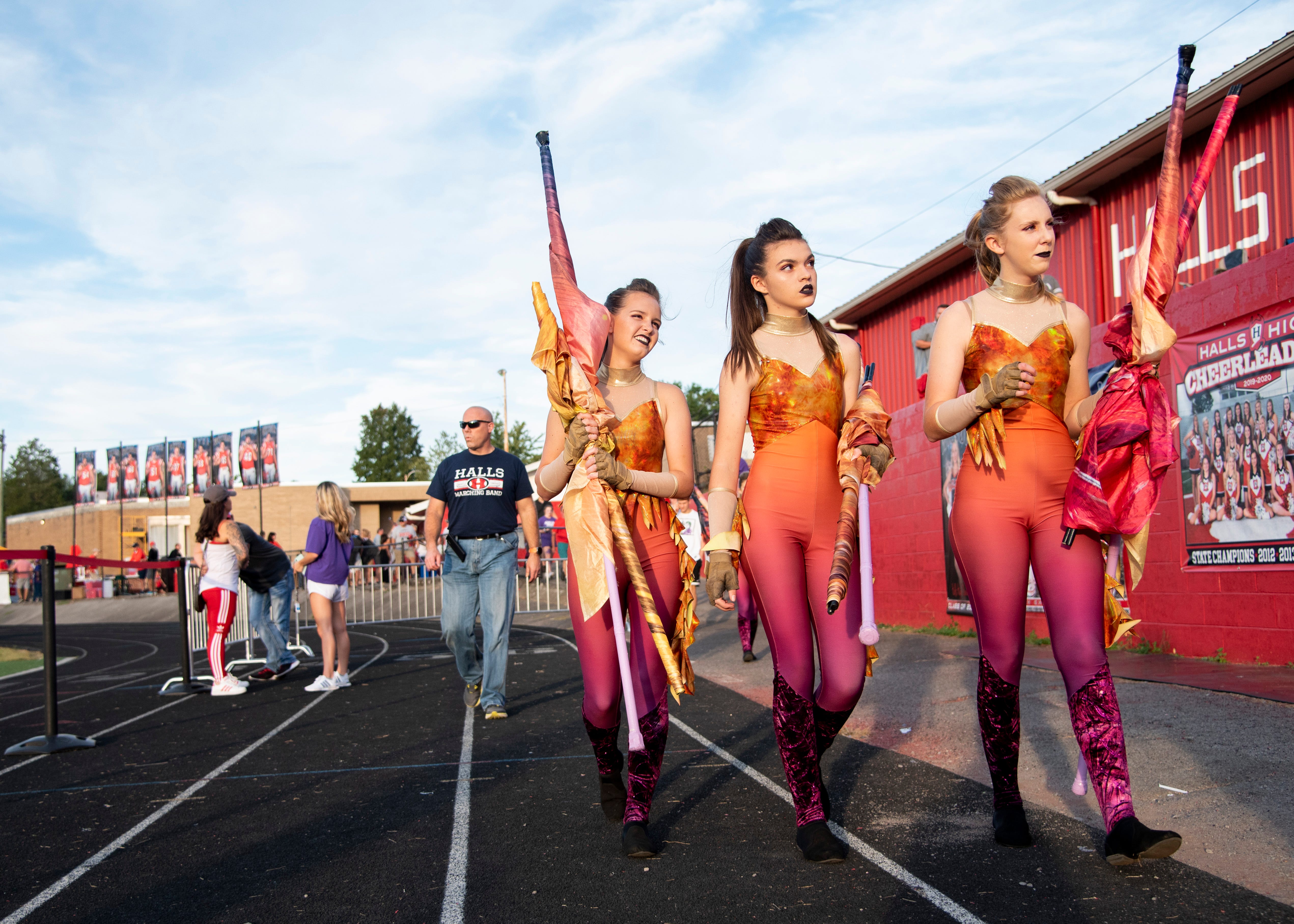 Halls color guard members before the Halls and Central high school football game on Friday, October 4, 2019 at Halls High School.