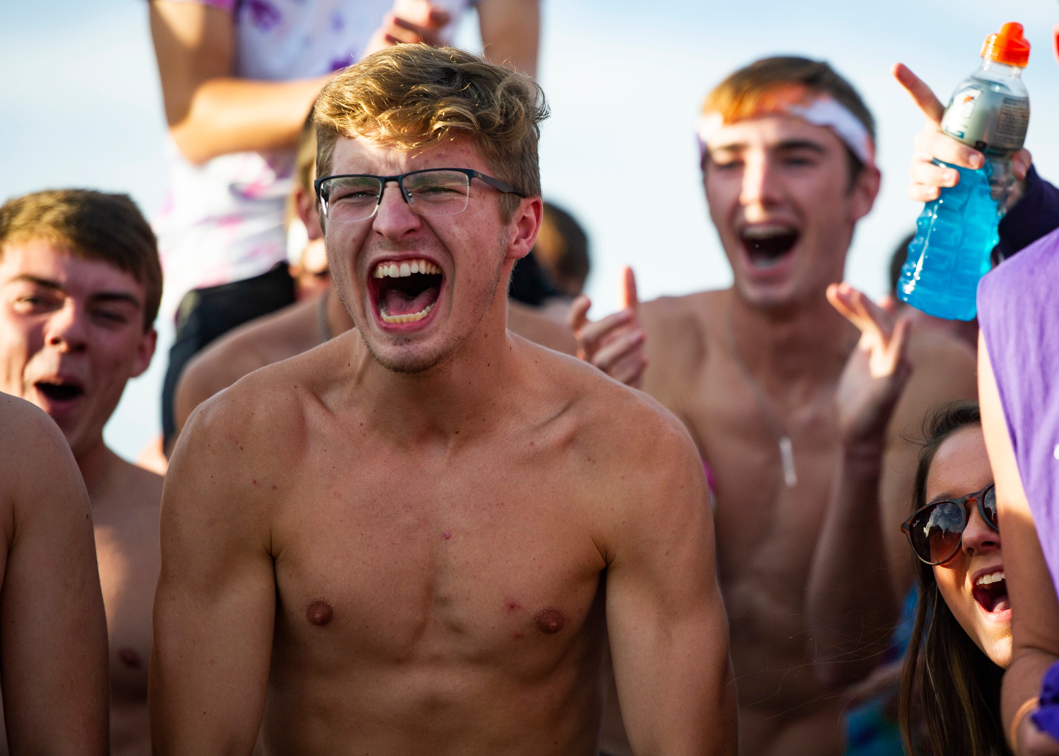 Students get pumped up for a live broadcast before the Halls and Central high school football game on Friday, October 4, 2019 at Halls High School.