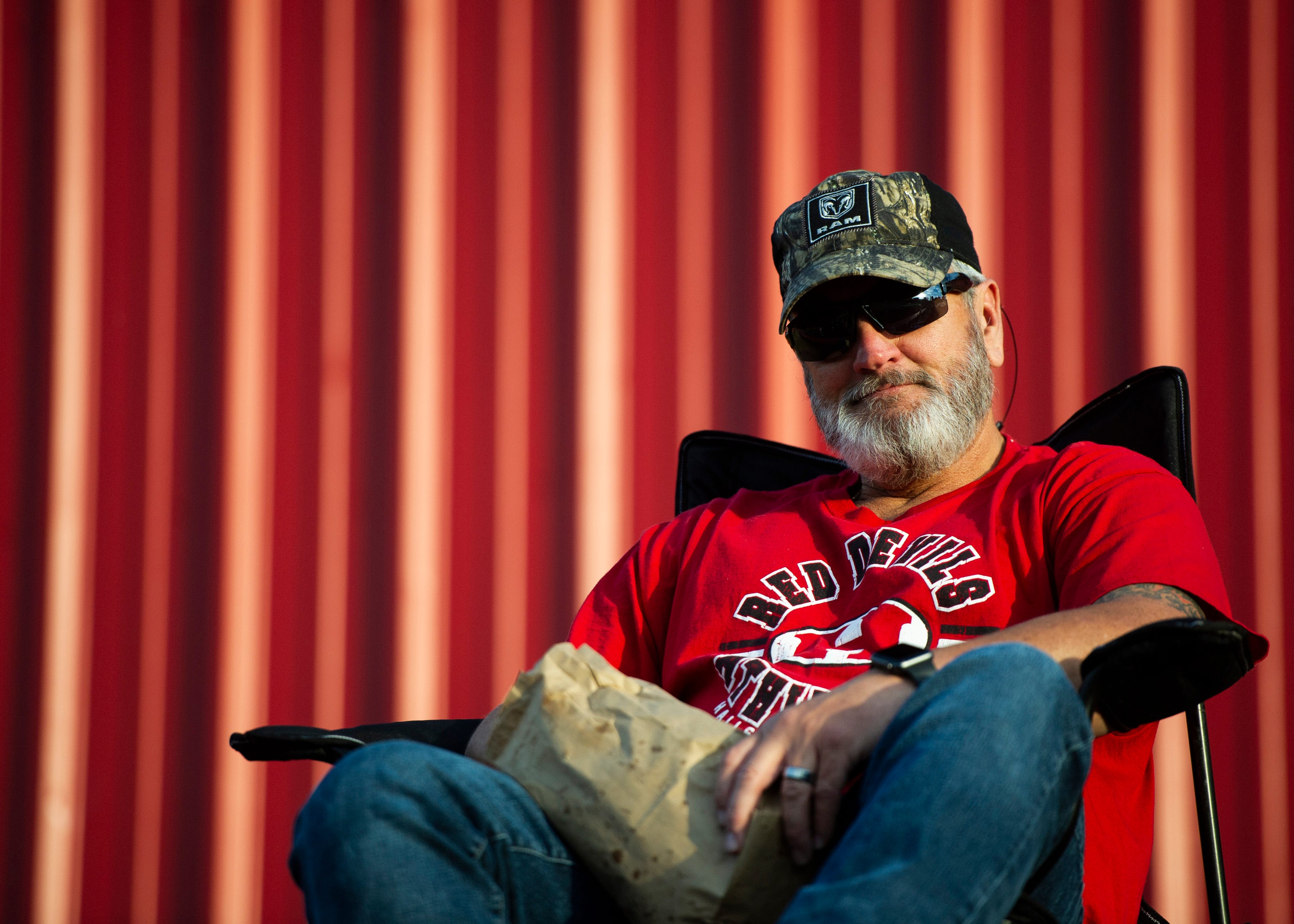 Halls fan, Steve Wise, watches the field before the Halls and Central high school football game on Friday, October 4, 2019 at Halls High School.