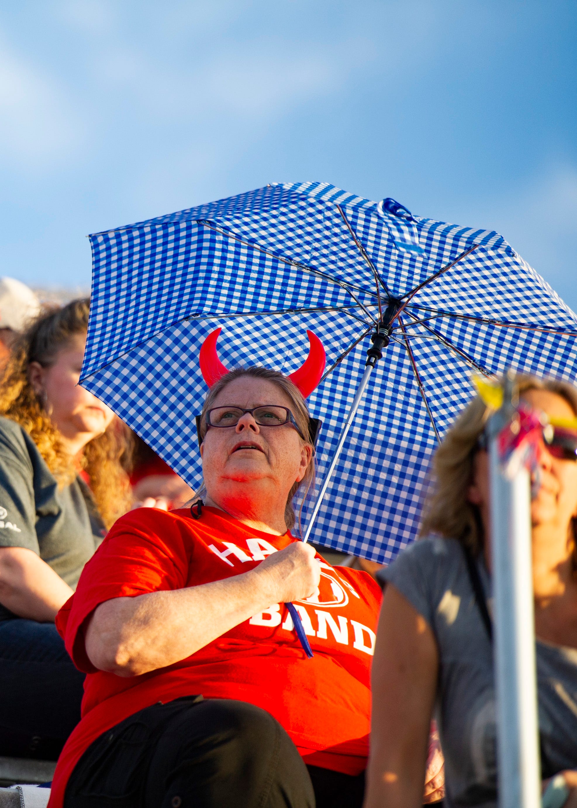 A Halls fan sits in the stands before the Halls and Central high school football game on Friday, October 4, 2019 at Halls High School.