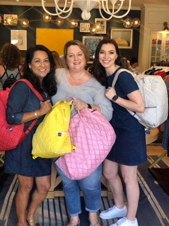 Cara Finger (middle) stands with supporters (left) Trish Elam of Pandy Cotton Candy and Presley Russell of Draper James, at the launch last week of her new nonprofit My Bag My Story at Draper James in Nashville.