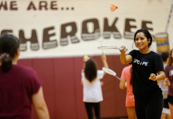 Springfield Police Department Public Information Officer Jasmine Bailey plays badminton with seventh-grade students at Cherokee Middle School as part of the SPD in PE program on Wednesday, Oct. 16, 2019.