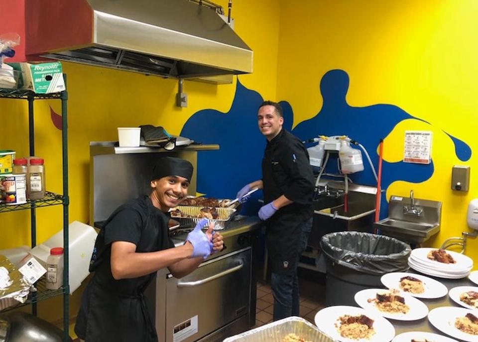 Seventeen-year-old Bryan (left) learned how much he enjoys cooking after he began working with Chef David Ortiz in the kitchen of the Boys & Girls Clubs of Puerto Rico in Isabela. 