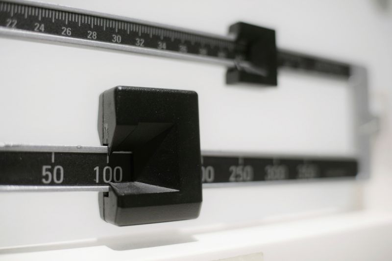 This Tuesday, April 3, 2018 photo shows a closeup of a beam scale in New York. New research released on Wednesday, April 4, 2018 suggests there's a critical window for overweight kids to get to a healthy level. Those who shed their extra pounds by age 13 had the same risk of developing diabetes in adulthood as others who had never weighed too much, a large study of Danish men found. (AP Photo/Patrick Sison)