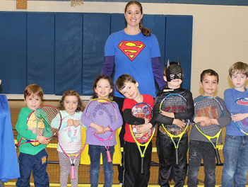 Youth Fitness Director, Holly Metzger-Brown and her kids at the York JCC line up for a photo before their tennis class.