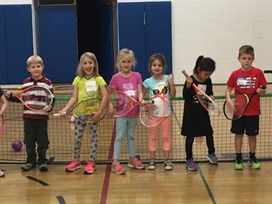 Kids at the York JCC line up for a photo before their tennis class.