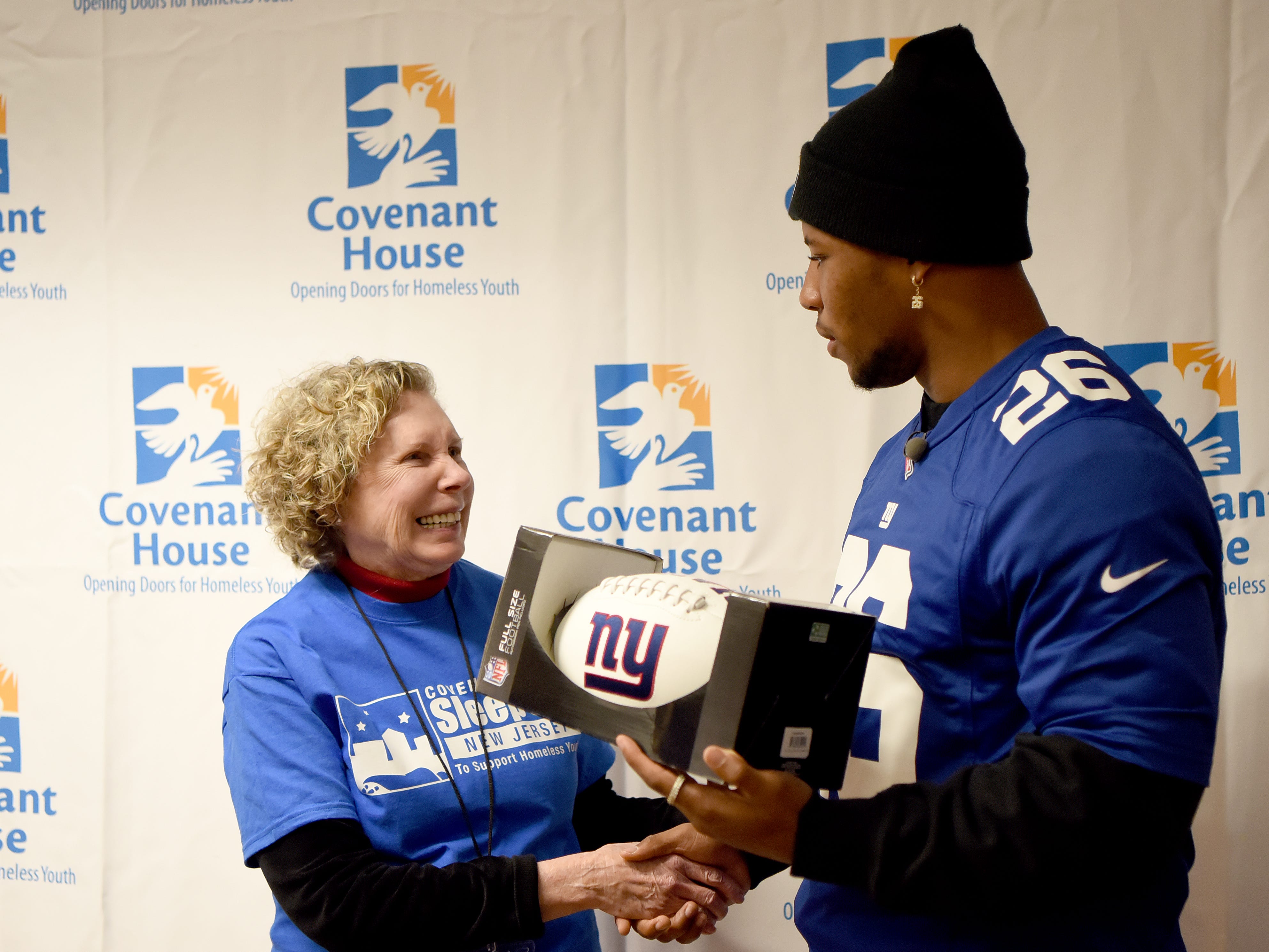 Covenant House holds a Sleep Out Executive Edition in Newark on Thursday November 21, 2019. Beth Lawrence shakes Saquon Barkley's hand. Barkley plays for the Giants and is the Sleep Out: Executive Edition Chairman.