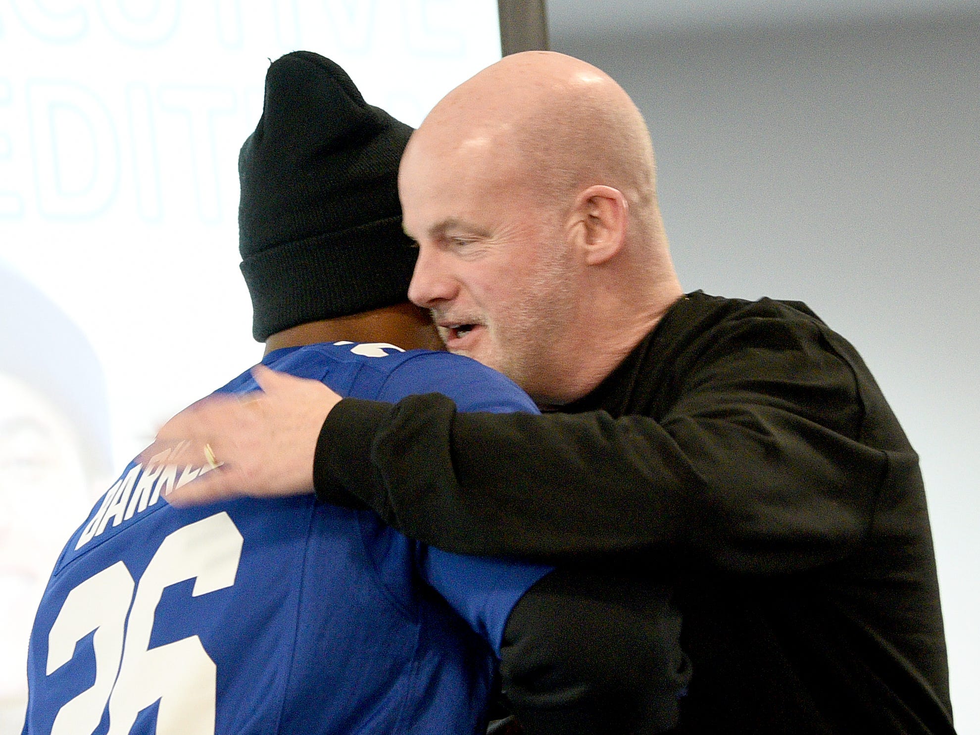 Covenant House holds a Sleep Out Executive Edition in Newark on Thursday November 21, 2019. Saquon Barkley a player with the Giants and Sleep Out: Executive Edition Chairman hugs the top fundraiser Jim O'Brien.